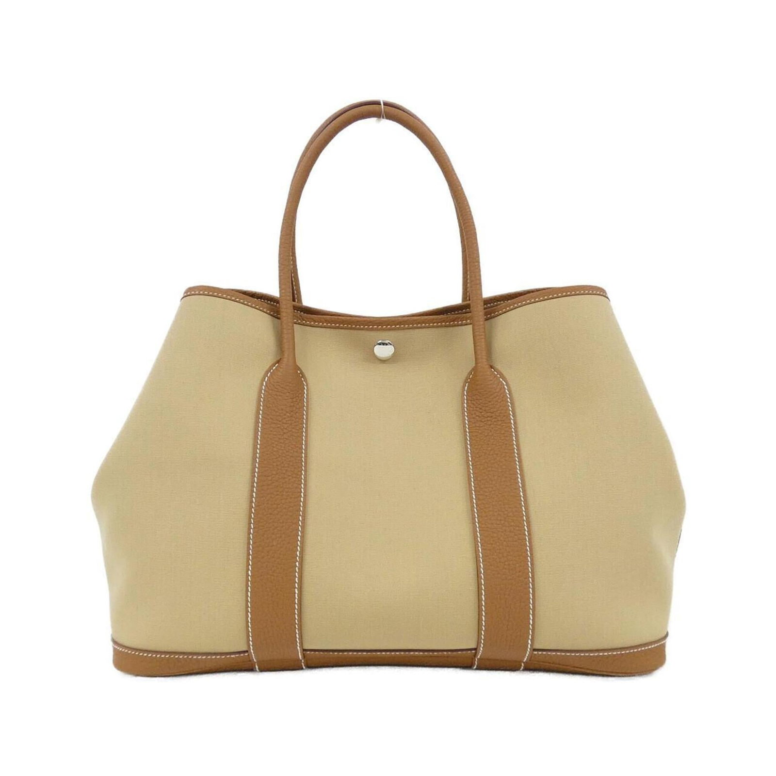 Handbag Hermes Negonda Leather: Handbag Hermes Negonda Leather Negonda leather handbag from Hermes, featuring gold hardware and silver accents, with a sleek 26cm x 36cm x 18cm size. This luxurious handbag showcases the brand's