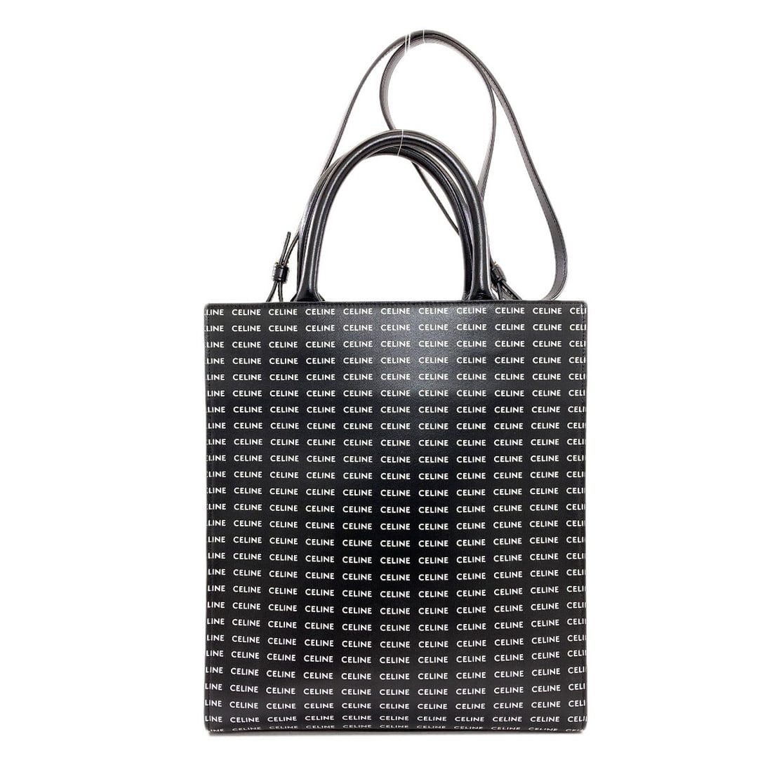 Cabas Vertical Handbag 2Way Pvc Celine: Cabas Vertical Handbag 2Way Pvc Celine Cabas Vertical Handbag features a sleek black exterior made from PVC, a versatile and durable material. The 2-way design allows for multiple entry and exit