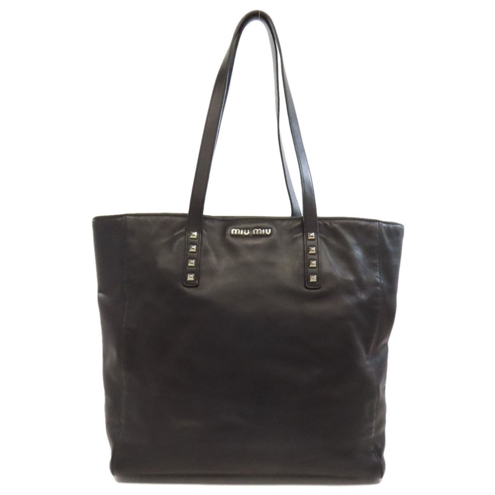 Miu Tote Bag Leather: Miu Tote Bag Leather Black leather Miu Miu tote bag with a classic design and clean lines, measuring 31cm x 41cm x 10.5cm. Made from high-quality leather, this stylish bag is a great addition to any