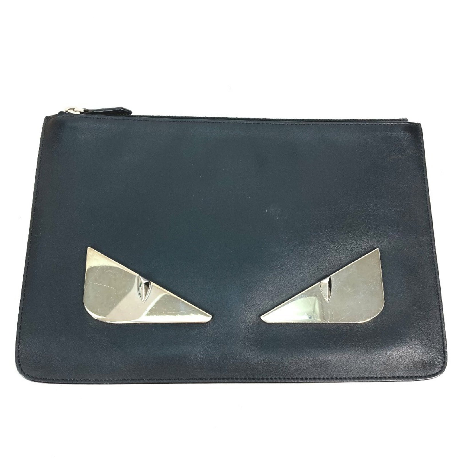 Fendi Bag Leather Clutch: Fendi Bag Leather Clutch The Fendi Bag Leather Clutch boasts a sleek black leather design, featuring a sturdy zipper closure and a compact size that fits perfectly in any handbag collection. With its