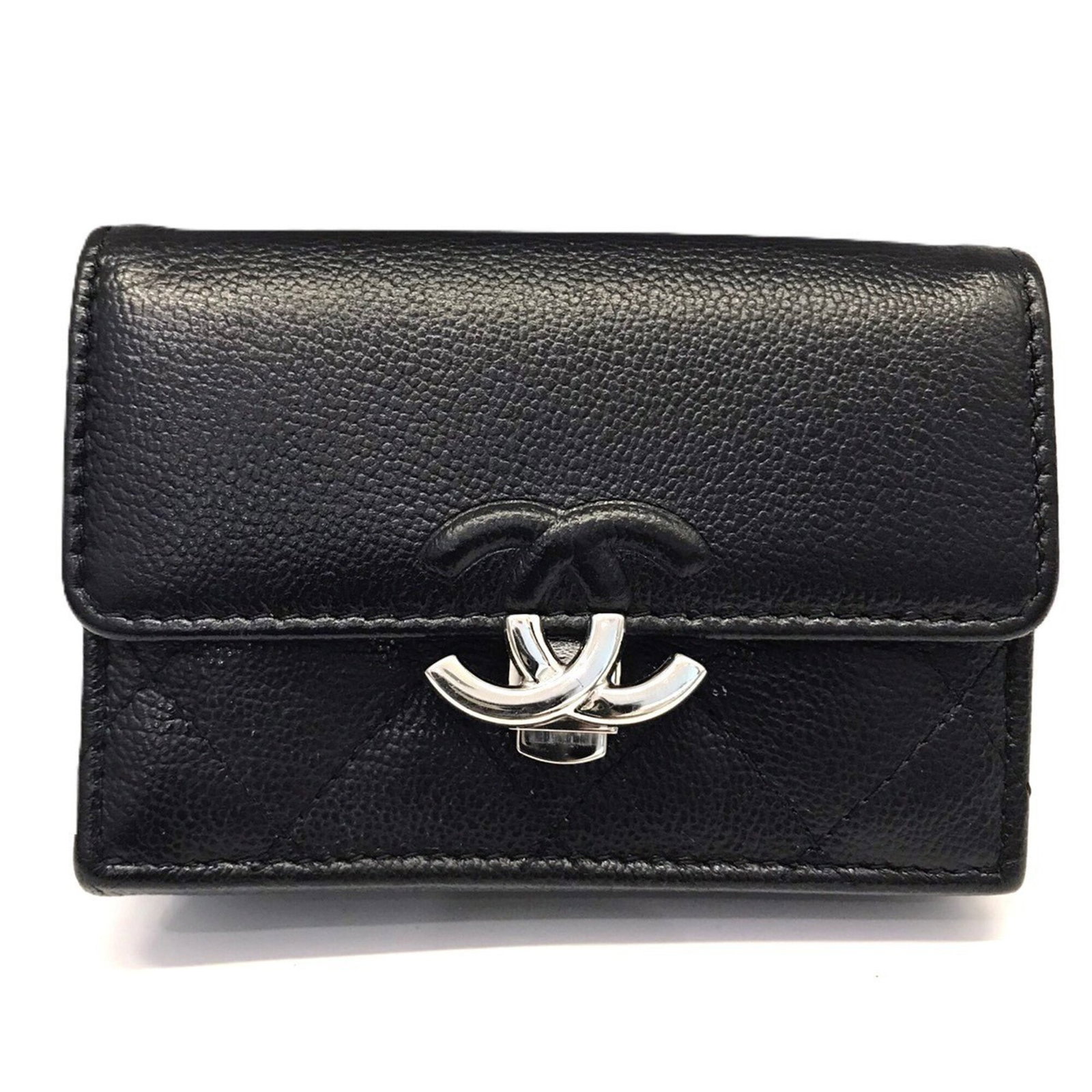 Chanel Wallet (Tri-Fold) Grained Calfskin: Chanel Wallet (Tri-Fold) Grained Calfskin Tri-fold wallet in black grained calfskin, a classic design from Chanel. This sleek and timeless piece is crafted from high-quality leather, with clean lines