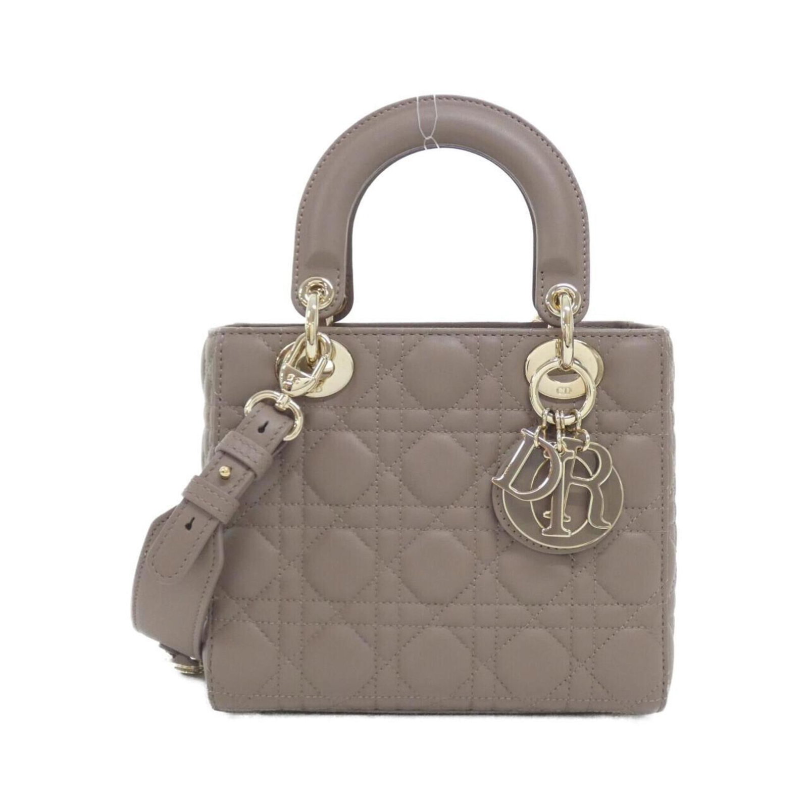 Handbag Leather Dior Christian: Handbag Leather Dior Christian The Christian Dior MPN M0538OCEA Handbag features a luxurious lambskin exterior in rich brown color, showcasing the brand's signature style. Measuring 17cm x 20cm x