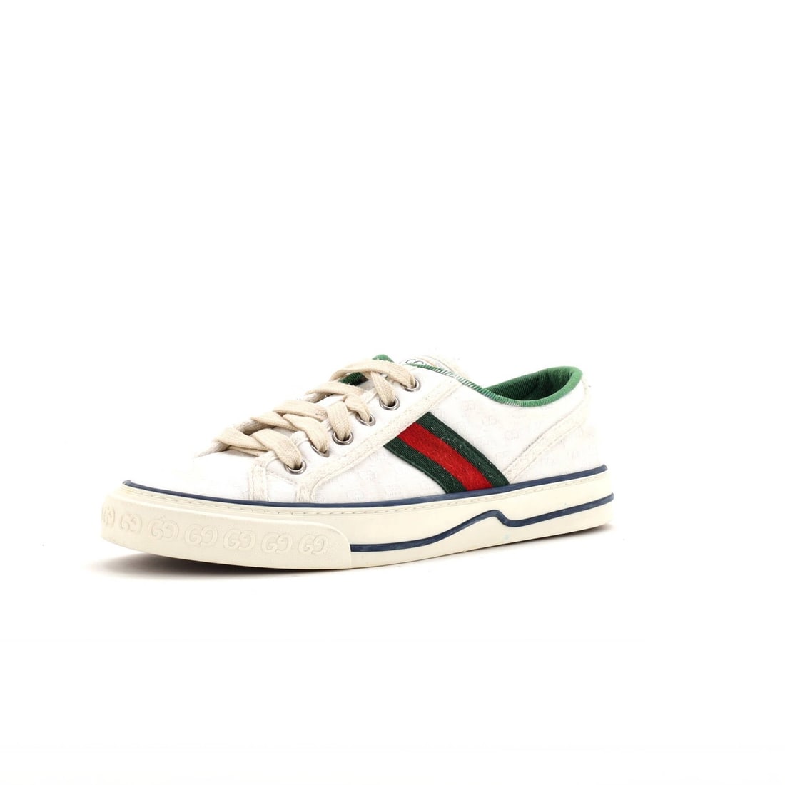 Gucci Tennis Sneakers 1977 Mini Canvas: Gucci Tennis Sneakers 1977 Mini Canvas White Gucci Tennis Sneakers from 1977 feature a mini canvas design with multicolor accents, showcasing the iconic GG logo. The shoes have a canvas upper, plain