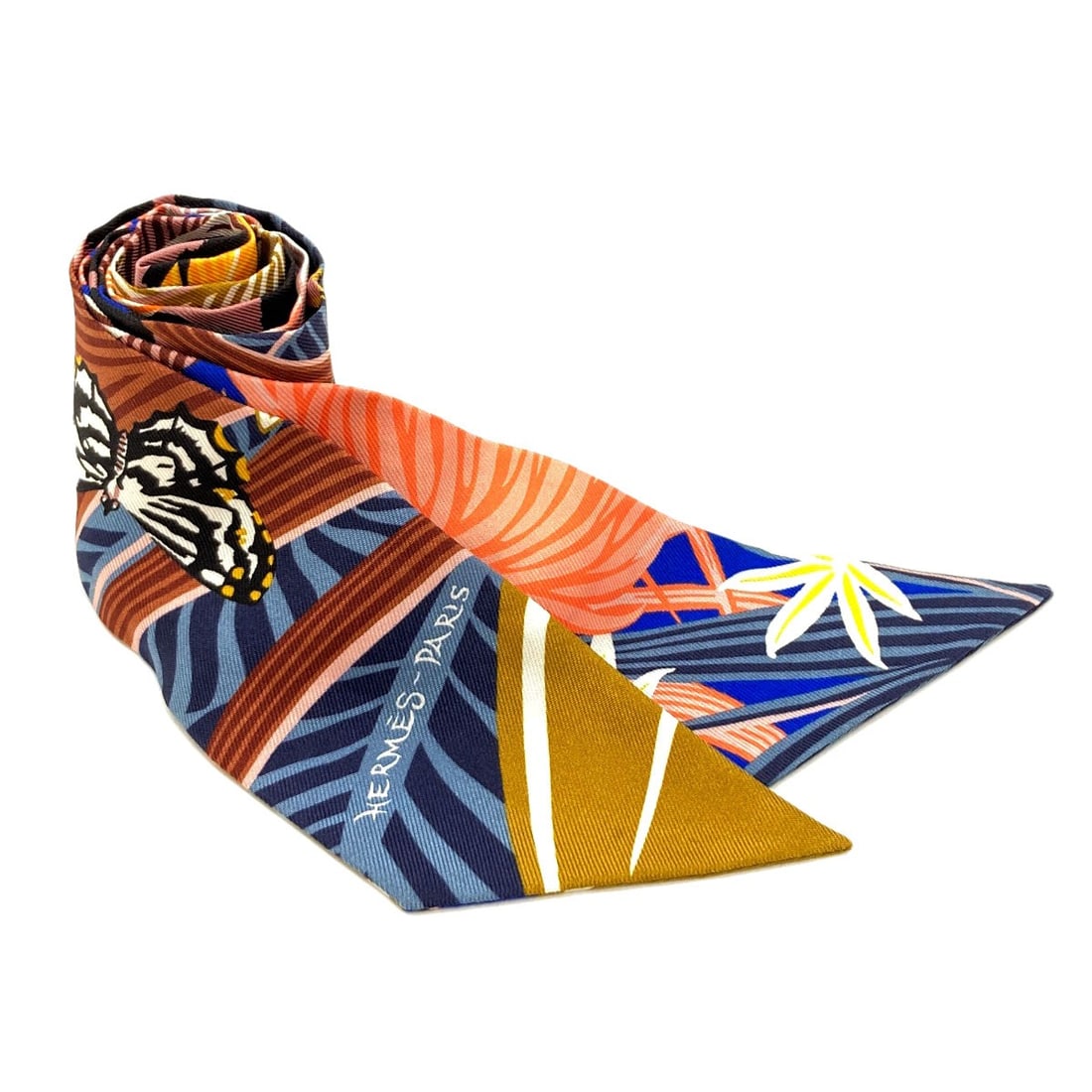 Hermes Silk Twilly Scarf: Hermes Silk Twilly Scarf Silk Twilly Scarf from HERMES, featuring a multicolor design. Made from high-quality silk, this scarf showcases a unique multicolor exterior. A notable aspect of this item is 