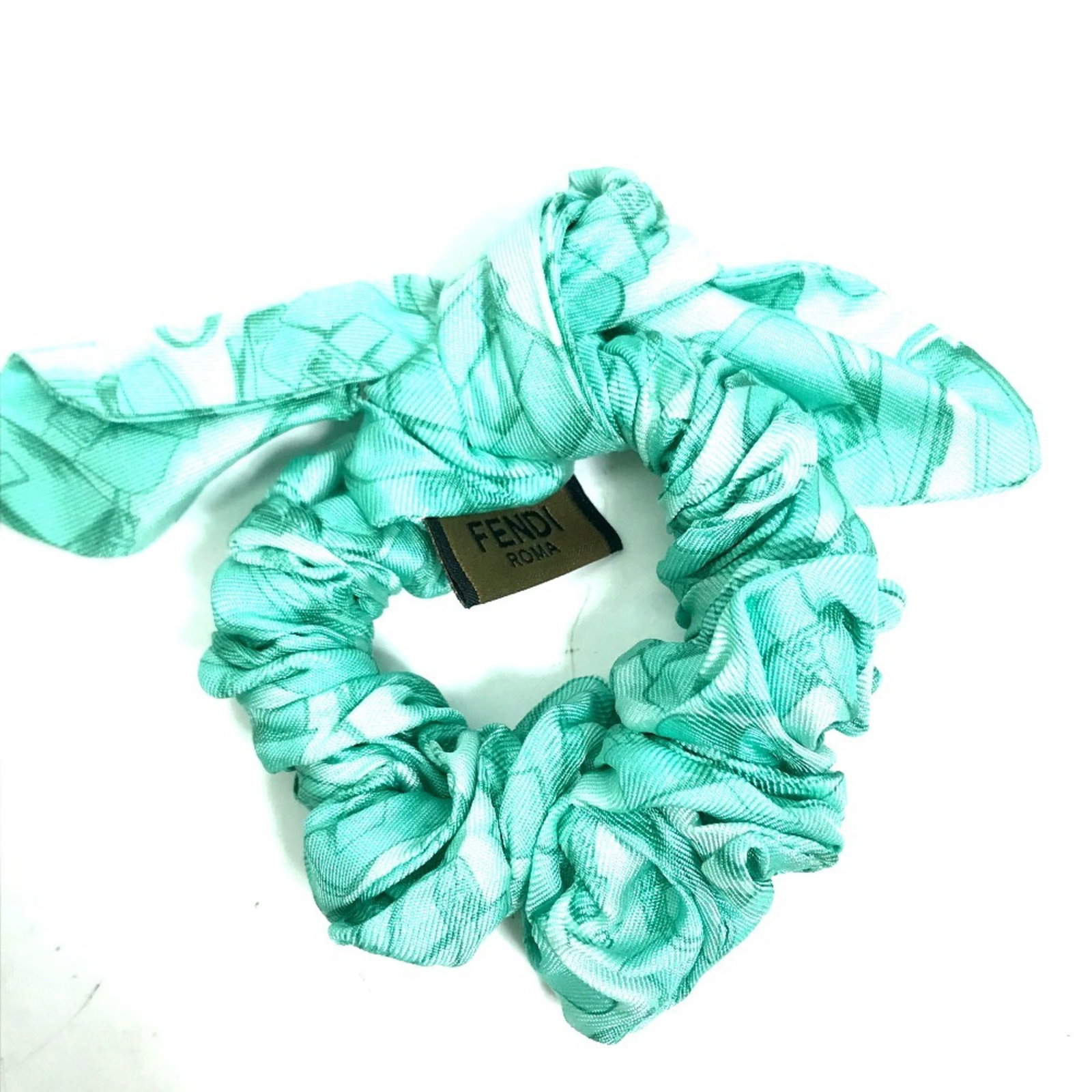 Ribbon Fendi Silk: Ribbon Fendi Silk Fendi Silk Ribbon is a vibrant green ribbon made from high-quality silk, measuring 12cm x 4.72'' in size. This ribbon is a simple yet elegant accessory, showcasing the luxurious feel