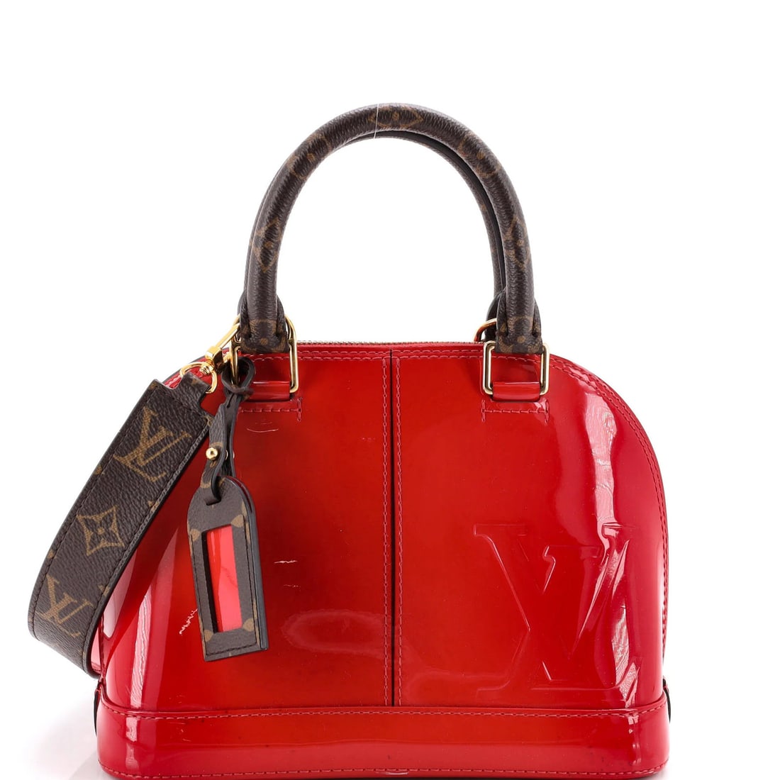 Vuitton Louis Alma Handbag Vernis with Monogram Canvas: Vuitton Louis Alma Handbag Vernis with Monogram Canvas The Louis Vuitton Alma Handbag Vernis with Monogram Canvas is a striking red patent leather top handle bag. Measuring 9" high, 9" wide, and 6"