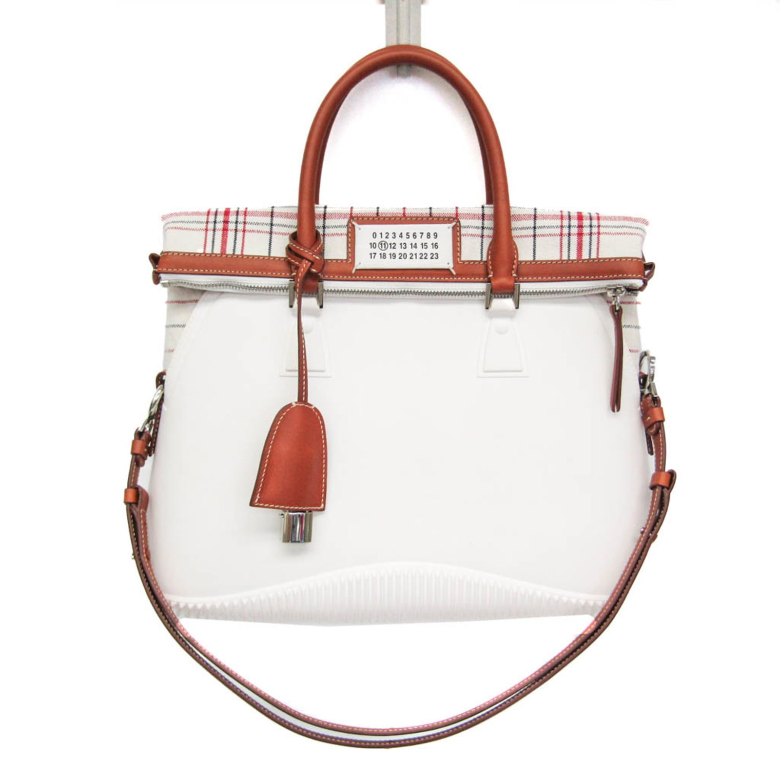 Maison Margiela Handbag Shoulder Bag Canvas Leather Rubber: Maison Margiela Handbag Shoulder Bag Canvas Leather Rubber This Maison Margiela handbag shoulder bag combines canvas, leather, and rubber in a unique blend of textures and materials. Featuring a 30cm