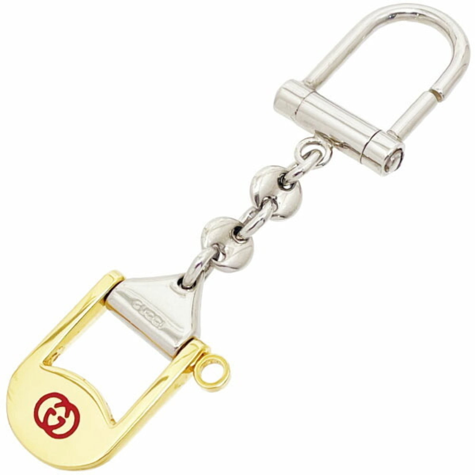Keyring Metal Gucci: Keyring Metal Gucci This Gucci keyring is made of metal and features a gold and silver finish. It measures 4cm x 2.3cm and comes in a box. The item bears a signature. Item Specifics: Brand: Gucci Type