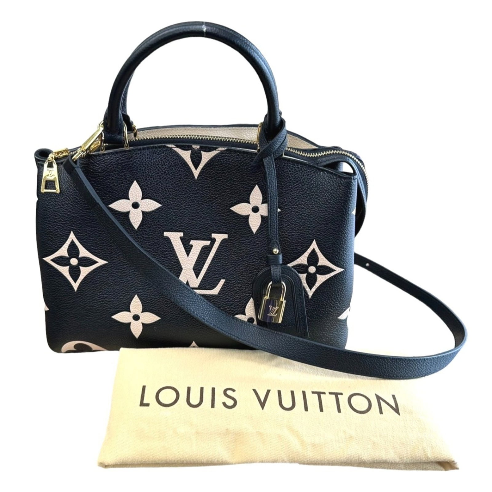 Shoulder Bag Monogram Empreinte Louis Vuitton: Shoulder Bag Monogram Empreinte Louis Vuitton Black Monogram Empreinte Louis Vuitton Shoulder Bag, complete with dust bag, name tag, padlock, and shoulder strap, offers a sleek and sophisticated
