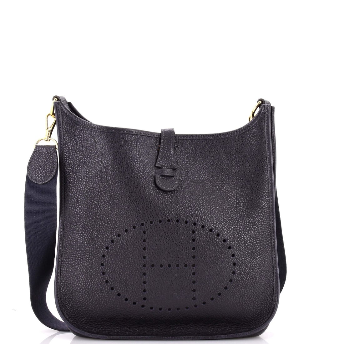 Evelyne Bag Gen I Clemence Hermes: Evelyne Bag Gen I Clemence Hermes Navy blue leather exterior, brass hardware, and raw leather interior define the classic Evelyne Bag Gen I Clemence PM from Hermes. This cross-body bag features a 19"