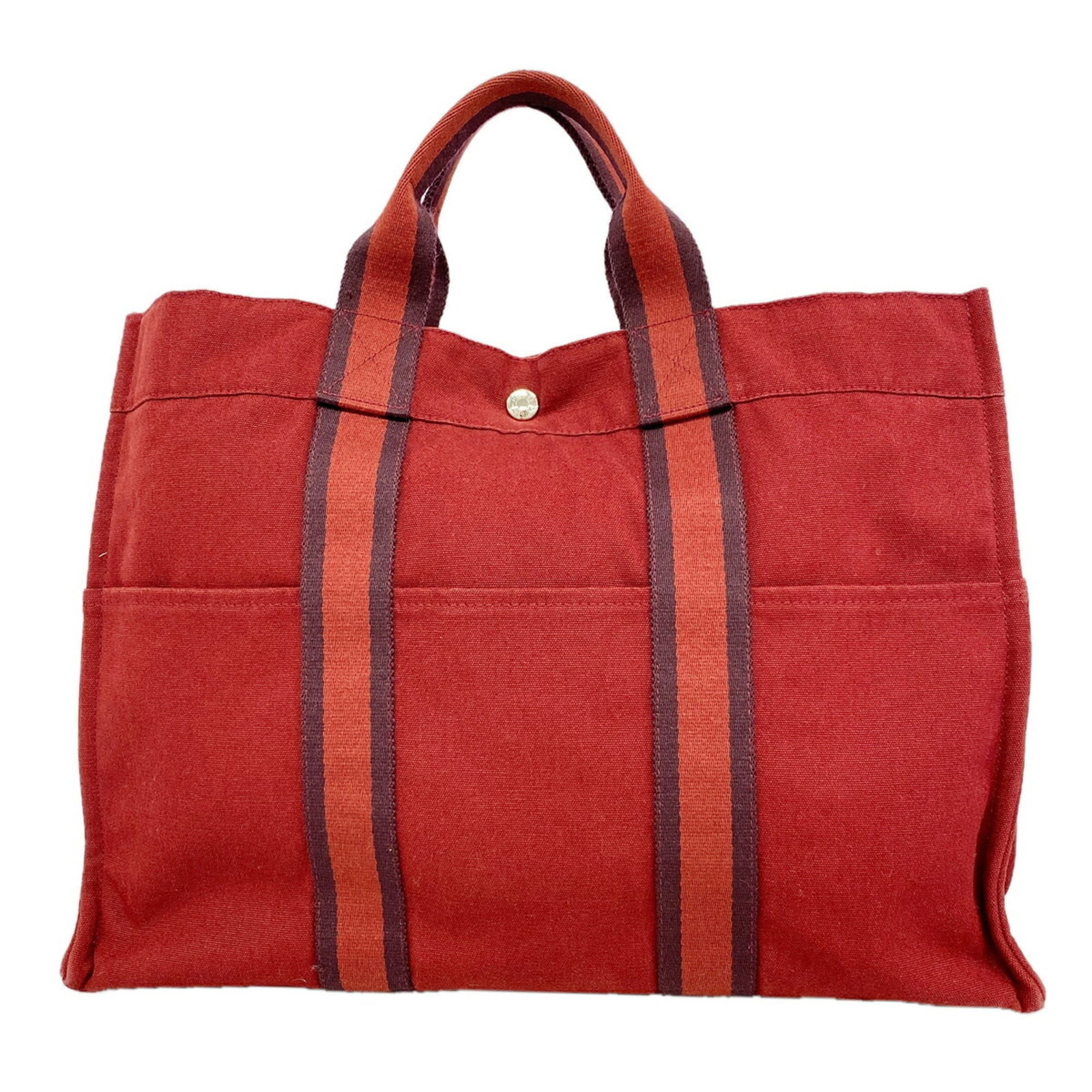 Canvas tote bag Hermes: Canvas tote bag Hermes Canvas tote bag from Hermes, featuring a striking red color and sleek silver hardware, with a durable canvas material that provides a sturdy and long-lasting design. The bag