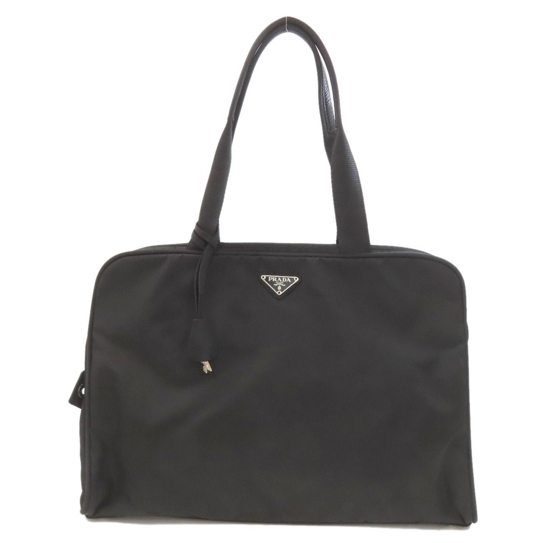 Logo Hardware Nylon Handbag Prada: Logo Hardware Nylon Handbag Prada Black Logo Hardware Nylon Prada Handbag. This black nylon handbag features a prominent logo hardware detail, a classic style, and a durable nylon exterior. The