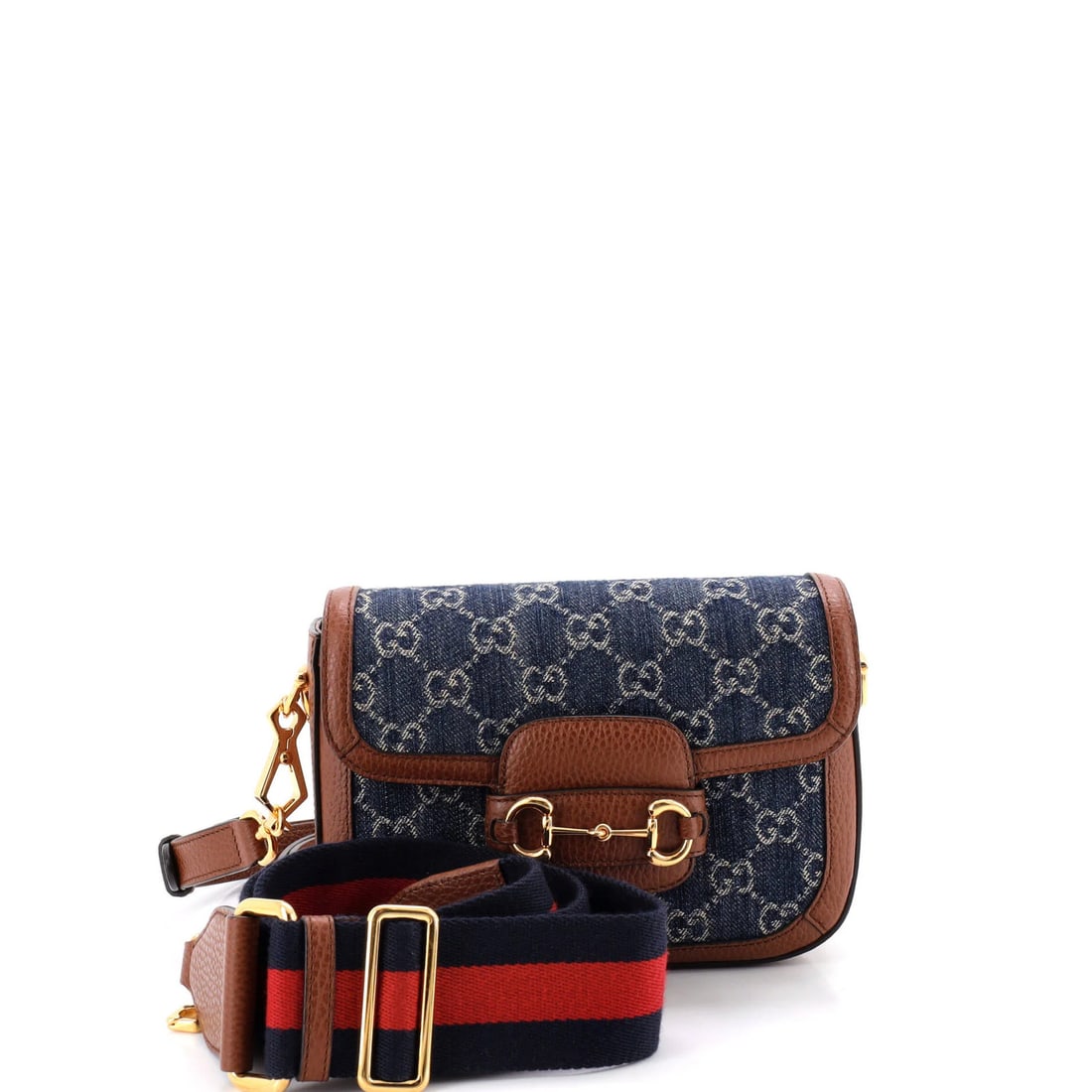 Gucci 1955 Horsebit Bag Denim Mini GG: Gucci 1955 Horsebit Bag Denim Mini GG Denim mini Horsebit 1955 GG shoulder bag from Gucci, featuring a classic design with a blue exterior and neutral interior. This mini bag boasts a signature Horseb
