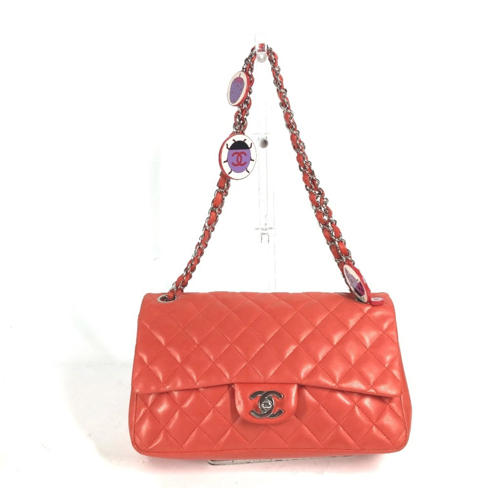 Shoulder Bag Leather Chanel: Shoulder Bag Leather Chanel This luxurious red lambskin shoulder bag from Chanel features a timeless design with clean lines and a classic silhouette. The bag is made from high-quality leather and