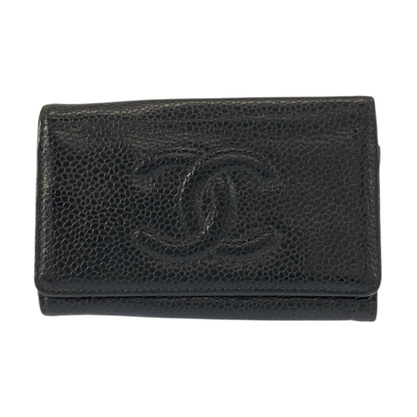 Keycase leather by Chanel: Keycase leather by Chanel Black leather keycase by Chanel, made in France with a sleek 7cm x 10.5cm x 1.5cm size. This stylish keycase features a classic design that complements any handbag or