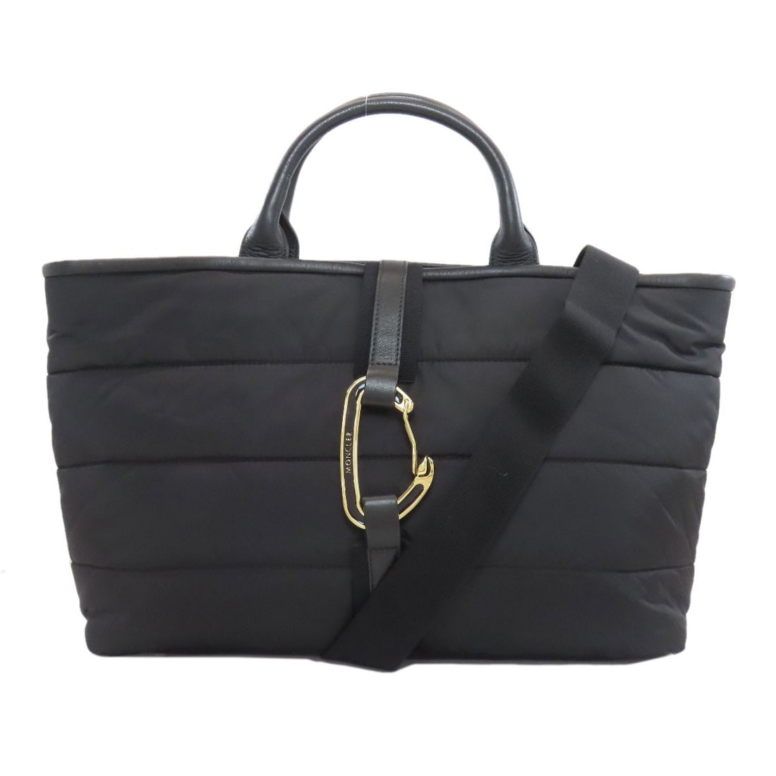 Moncler nylon handbag: Moncler nylon handbag Black Moncler nylon handbag with a sleek design. Made from high-quality nylon, this handbag features a black exterior that provides a chic and modern look. The signature Moncler