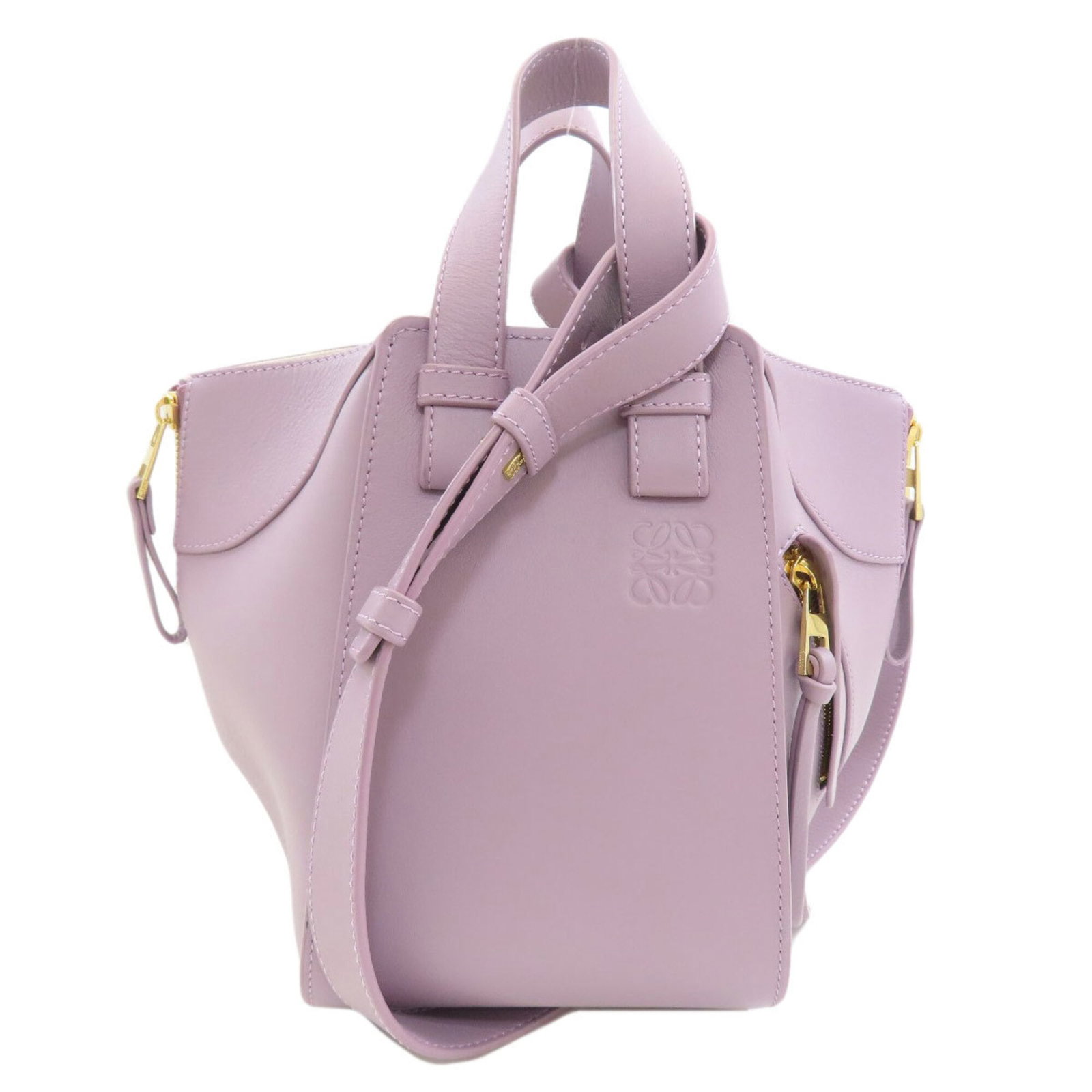 Handbag Leather Handbag: Handbag Leather Handbag Calfskin leather construction provides a luxurious feel, while the rich purple hue adds a touch of sophistication. This elegant handbag features a classic design with a hook cl