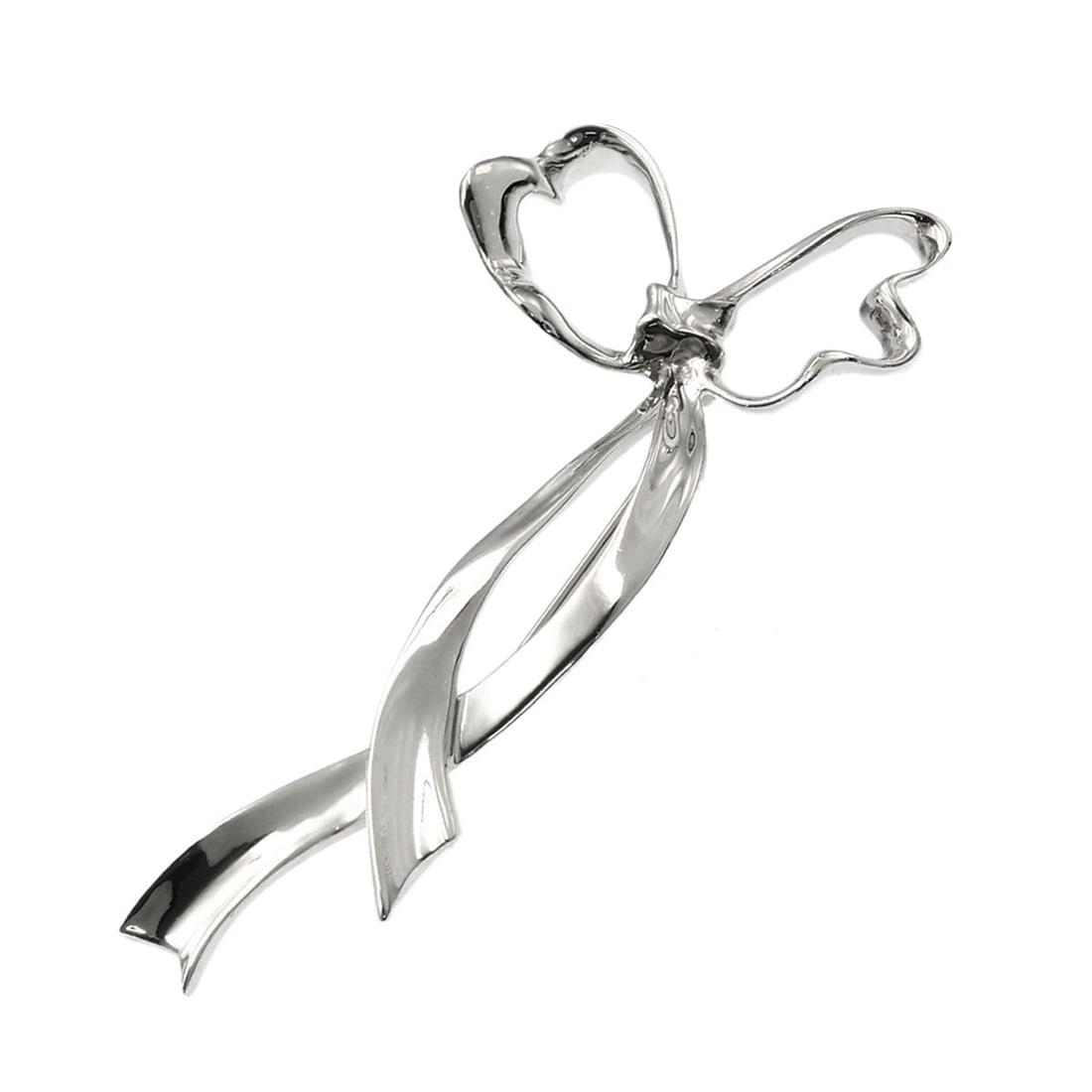 Tiffany Co Ribbon Motif Silver Brooch: Tiffany Co Ribbon Motif Silver Brooch Silver Ribbon Motif Brooch from Tiffany & Co. features a striking design with a silver ribbon motif, showcasing the luxury brand's signature style. Made from