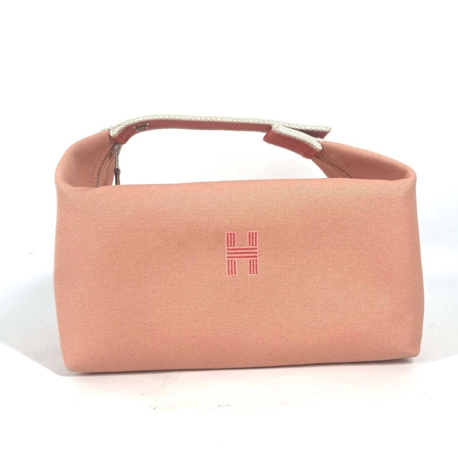 Canvas Handbag Vanity Pouch Hermes: Canvas Handbag Vanity Pouch Hermes Canvas Handbag Vanity Pouch from Hermes features a vibrant pink canvas material, measuring 12.5cm x 24.5cm x 15cm. This compact pouch is designed to be a stylish
