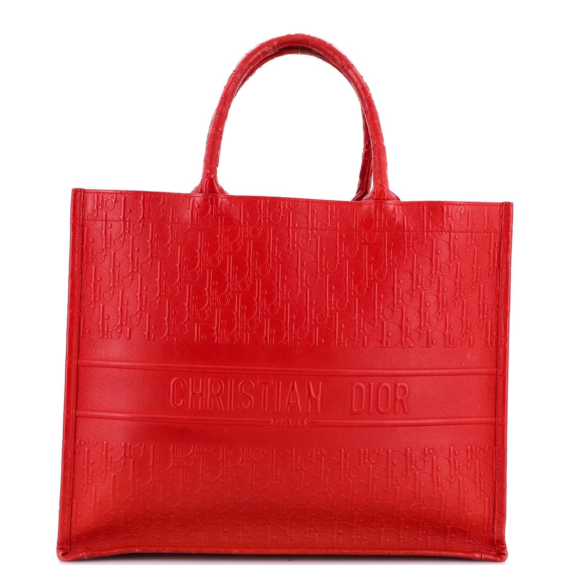 Christian Dior Oblique Embossed Calfskin Large Tote Book: Christian Dior Oblique Embossed Calfskin Large Tote Book The Christian Dior Oblique Embossed Calfskin Large Tote Book boasts a striking red exterior with oblique embossing, adding a touch of