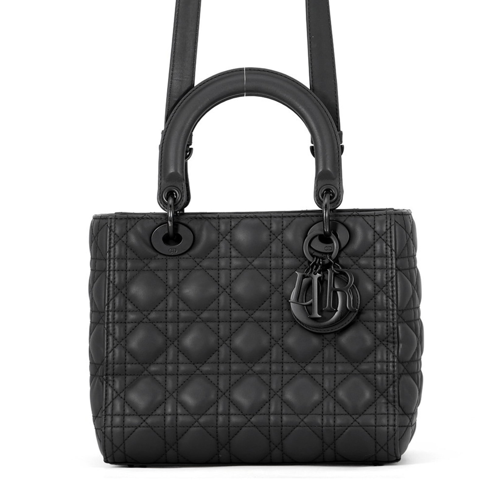 Handbag Leather Dior Christian: Handbag Leather Dior Christian The Lady Dior Country handbag from Christian Dior features a sleek black calfskin leather exterior, adorned with a classic flap closure. With a sturdy strap length of 10