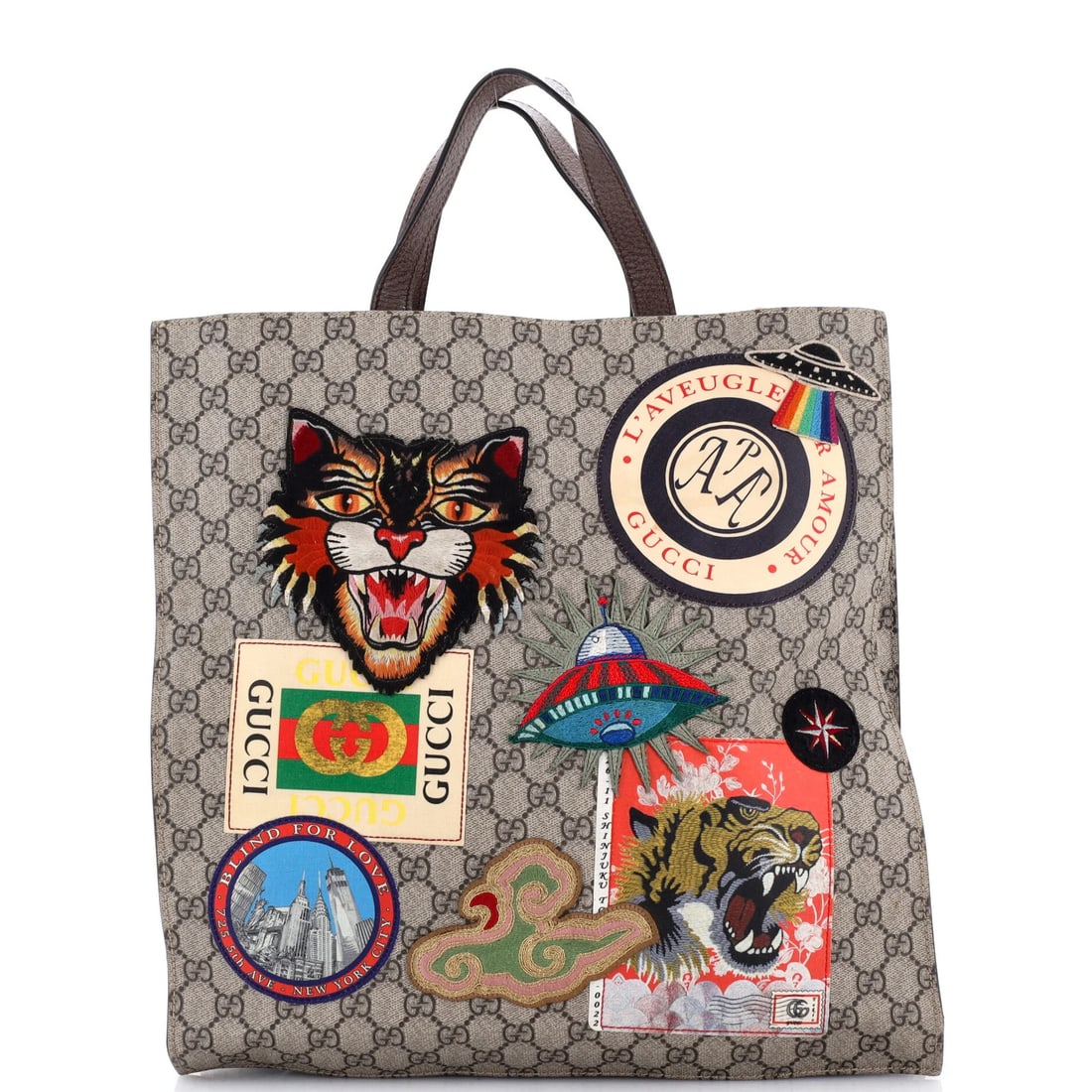 Soft Gucci Coated GG North Canvas Convertible Open Tote Applique With: Soft Gucci Coated GG North Canvas Convertible Open Tote Applique With Soft Gucci Coated GG North Canvas Convertible Open Tote Applique With Brown Exterior, 15" Height, 13.5" Width, and 2" Depth. This
