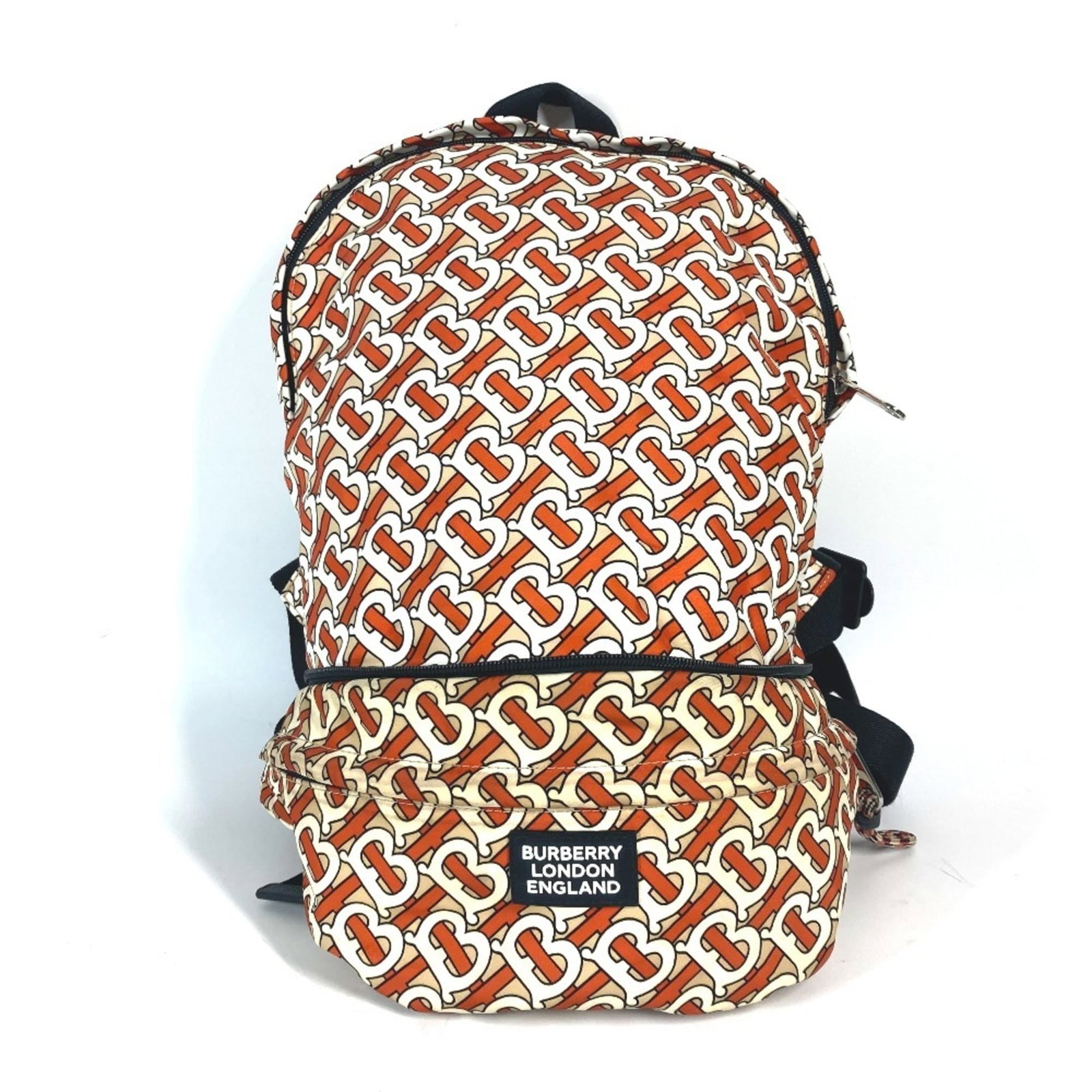 Burberry Fanny Pack Sling Bag Nylon: Burberry Fanny Pack Sling Bag Nylon Burberry's iconic nylon sling bag is a stylish and functional accessory, featuring a vibrant orange and white color scheme. Made from durable nylon, this fanny