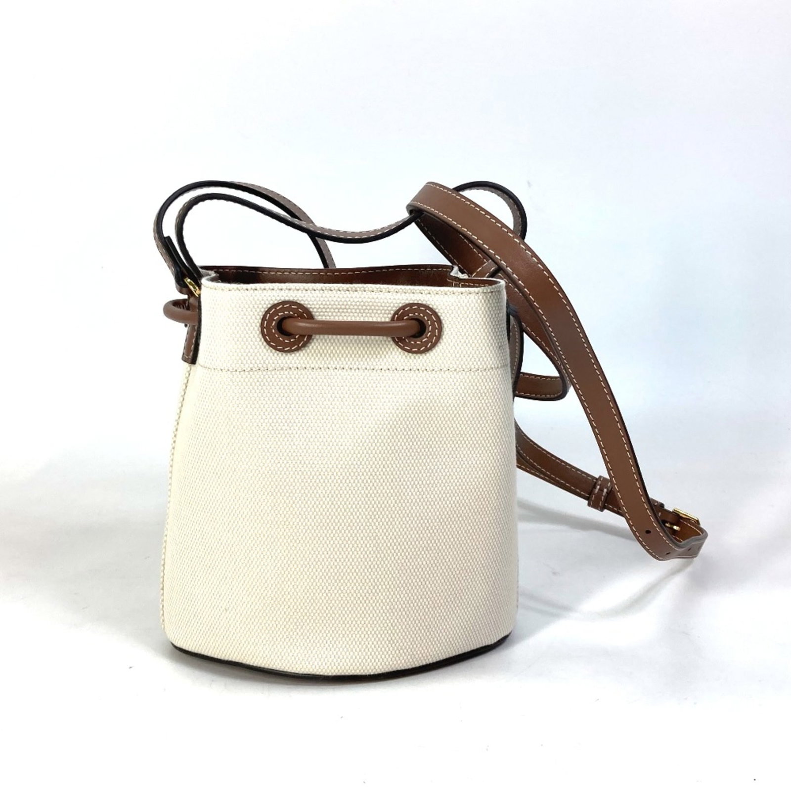 Tote bag other: Tote bag other Beige Burberry tote bag with a classic design, measuring 16cm x 16.5cm x 10.5cm, featuring a signature on the base. The bag has a long shoulder strap of 44.3 inches and a compact size,