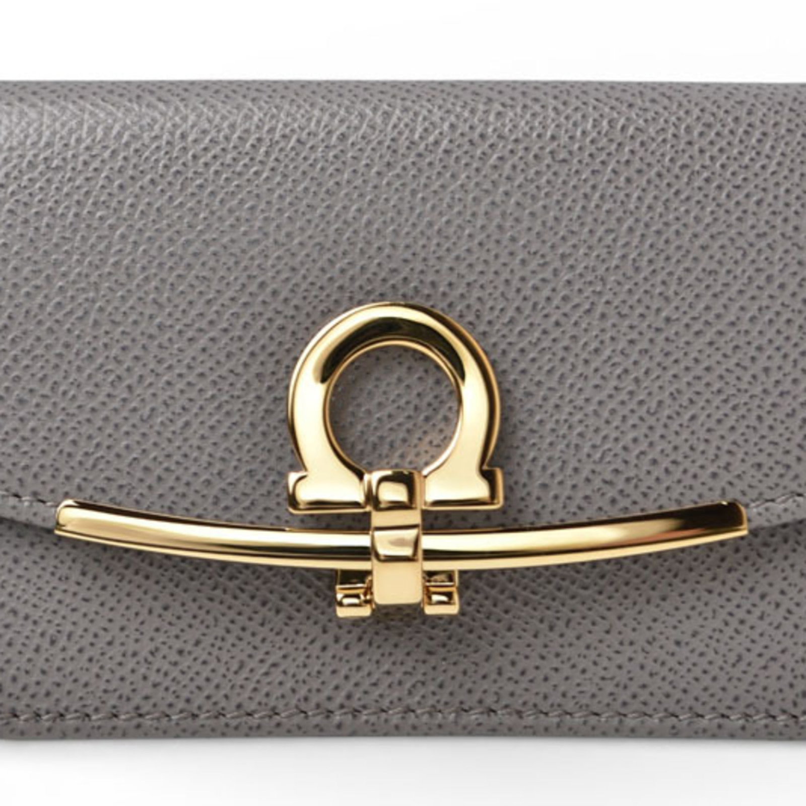 Salvatore Ferragamo Leather Card Case: Salvatore Ferragamo Leather Card Case The Salvatore Ferragamo Leather Card Case is a stylish and sophisticated accessory made from high-quality leather. Measuring 7.8cm x 11cm x 2.4cm, it features a