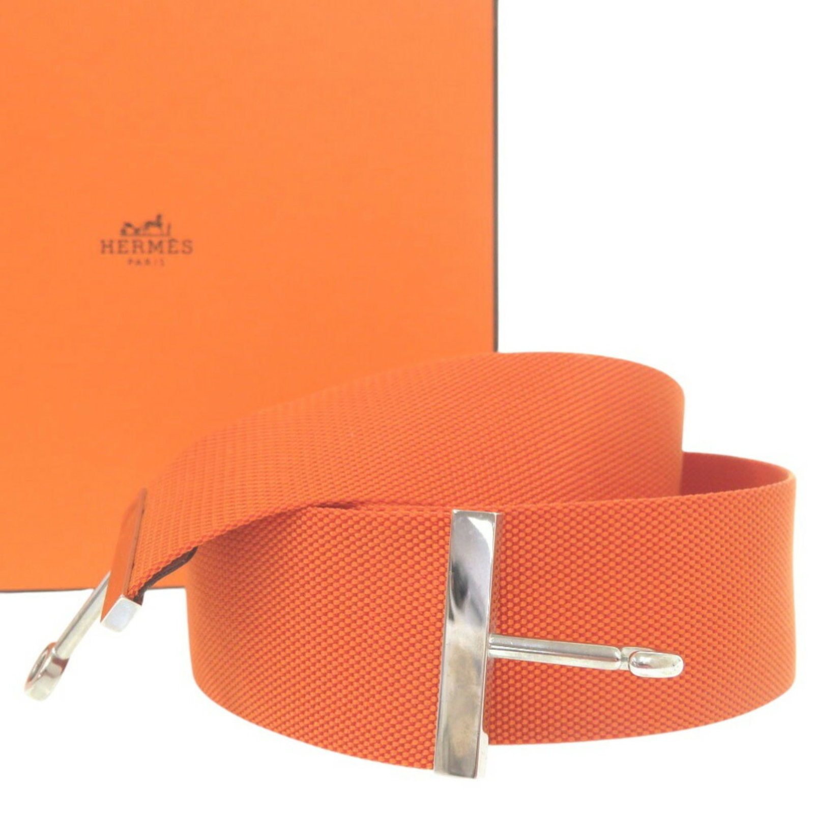 Hermes Standard Belt: Hermes Standard Belt Orange and silver details add a pop of color to this standard belt from Hermes, crafted from durable nylon and metal buckle. Measuring 82cm in length, it comes in a sleek design