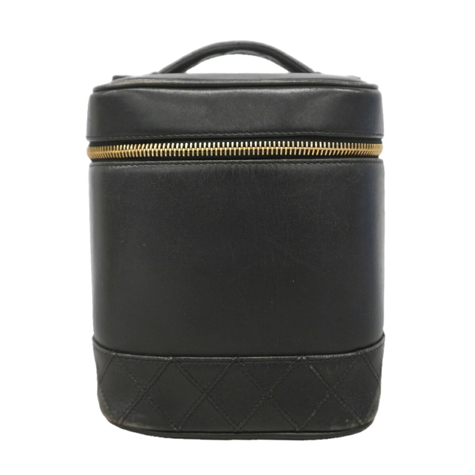 Vanity Bag Leather by Chanel: Vanity Bag Leather by Chanel This luxurious Chanel Vanity Bag is crafted from rich black lambskin leather, adorned with elegant gold hardware. Measuring 17.5cm x 15cm x 13cm, it is a sleek and
