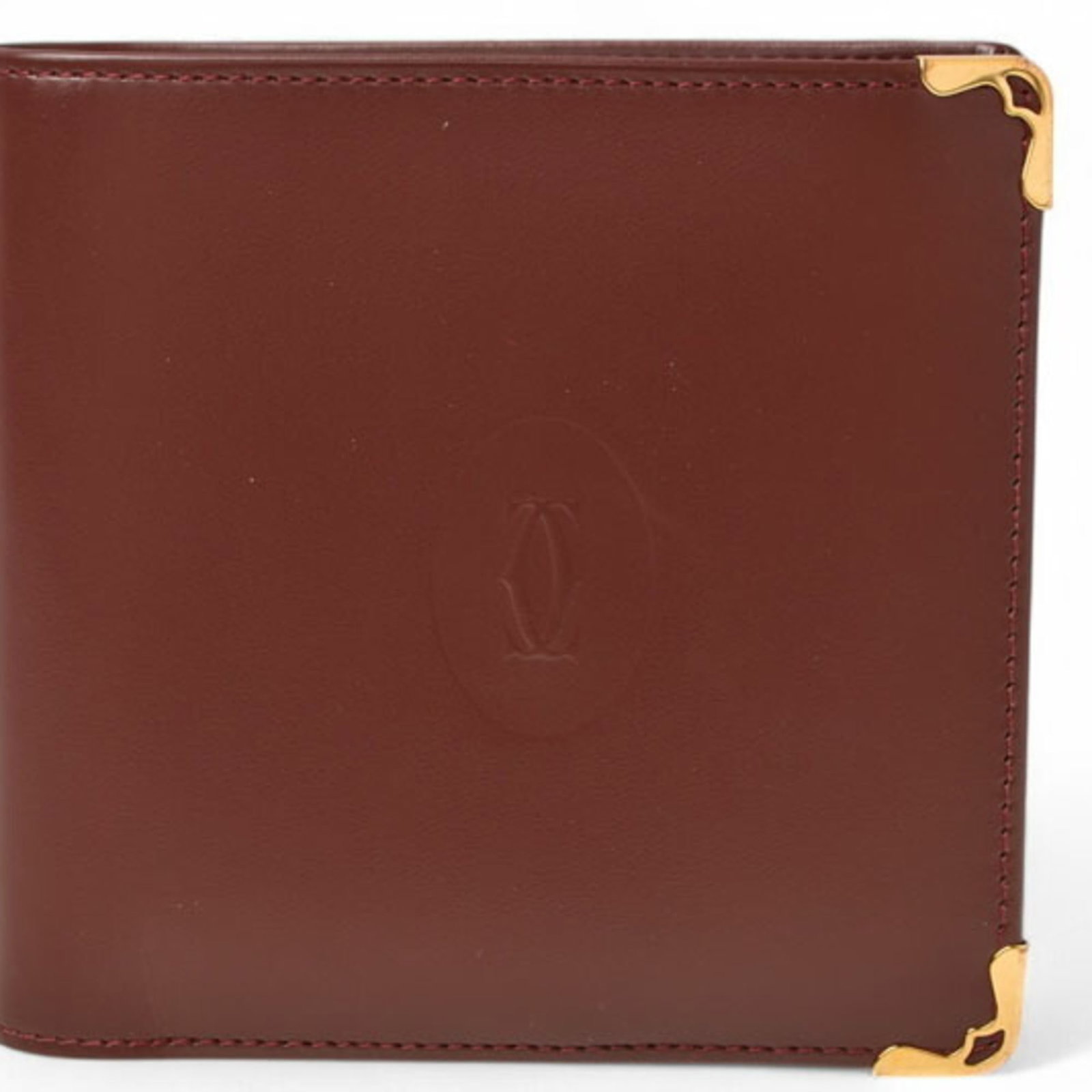 Cartier Wallet (Bi-Fold) Leather: Cartier Wallet (Bi-Fold) Leather Cartier's bi-fold leather wallet boasts a classic design with clean lines and a timeless aesthetic. Made from high-quality leather in a rich Bordeaux color, this walle