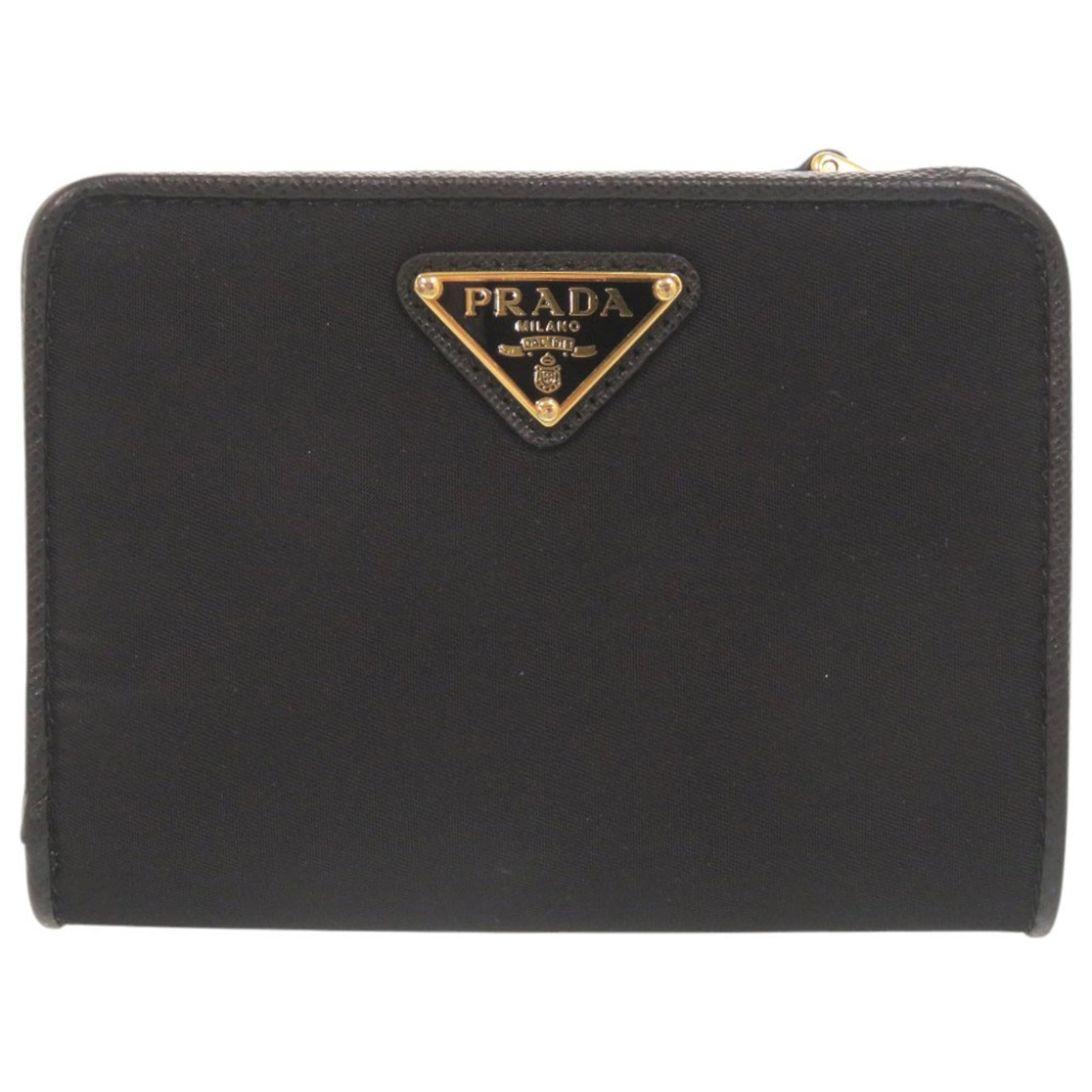 Nylon Leather Wallet Bi Fold: Nylon Leather Wallet Bi Fold Nylon and leather come together in a sleek, black bi-fold wallet from Prada, measuring 9cm x 12cm x 3cm. Its durable nylon exterior pairs with supple leather accents,