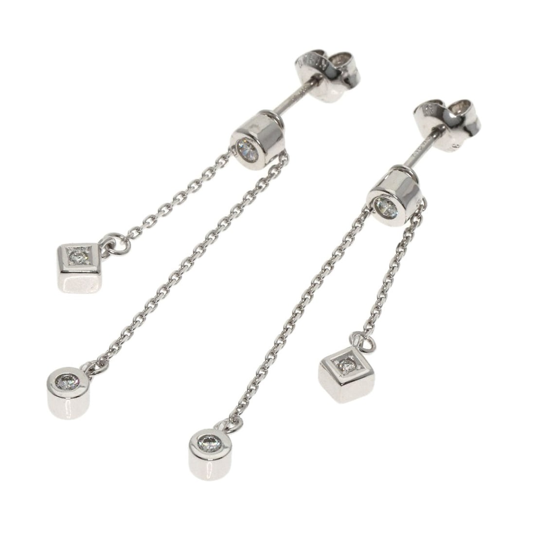 Diamond K18 Earring White Gold: Diamond K18 Earring White Gold K18 White Gold Diamond Earring: A delicate earring featuring two D-cut diamonds, each weighing 0.03ct and 0.02ct, set in a sleek silver metal frame. The earring is craft