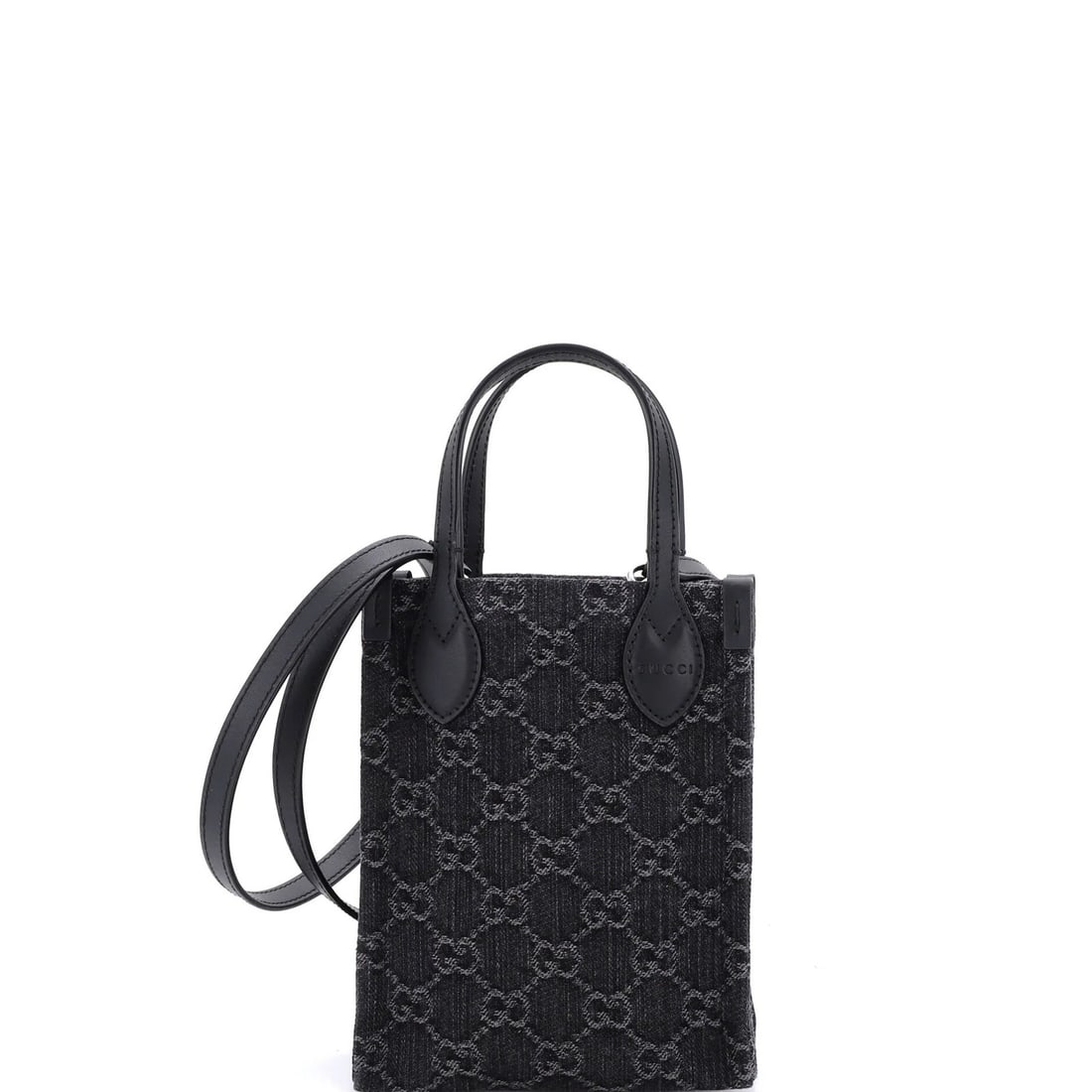 Vertical Tote Gucci Mini Denim GG: Vertical Tote Gucci Mini Denim GG Black Gucci Mini Denim GG Vertical Tote features a unique blend of leather and denim, showcasing Gucci's signature style. With its compact size and vertical design, t
