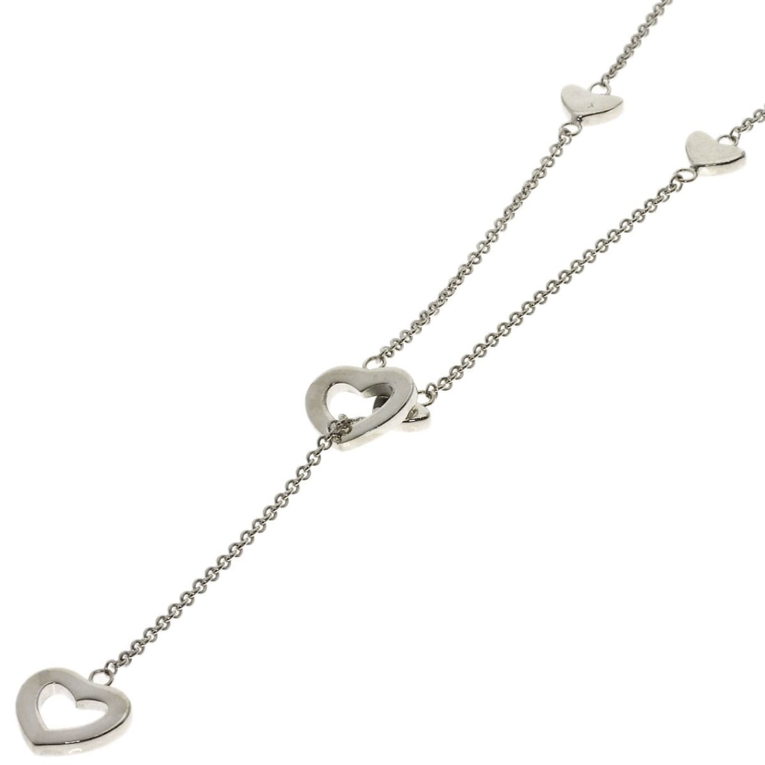 Tiffany Co Heart Link Lariat Silver Necklace: Tiffany Co Heart Link Lariat Silver Necklace Tiffany & Co's Heart Link Lariat Silver Necklace is a sleek and modern design, featuring a silver chain with a 19.2-inch length. The necklace bears a