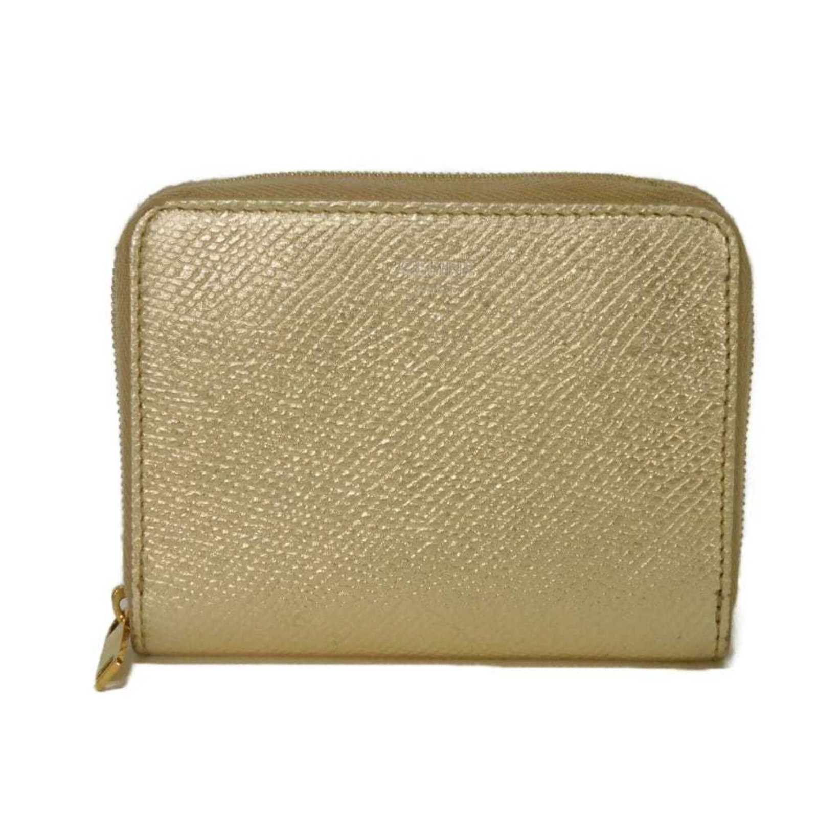 Celine Coin Purse/ Coin Case Leather: Celine Coin Purse/ Coin Case Leather Gold Metallic Celine Coin Purse/ Coin Case Leather, 8.8cm x 11cm x 2.3cm, made from high-quality leather. This compact coin purse features a sleek metallic gold