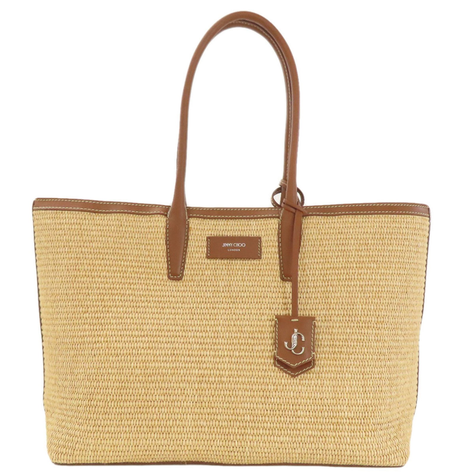 Raffia Leather Jimmy Choo Tote Bag: Raffia Leather Jimmy Choo Tote Bag Raffia Leather Jimmy Choo Tote Bag in Brown. This stylish tote features a unique combination of raffia and leather materials, with a spacious interior and a