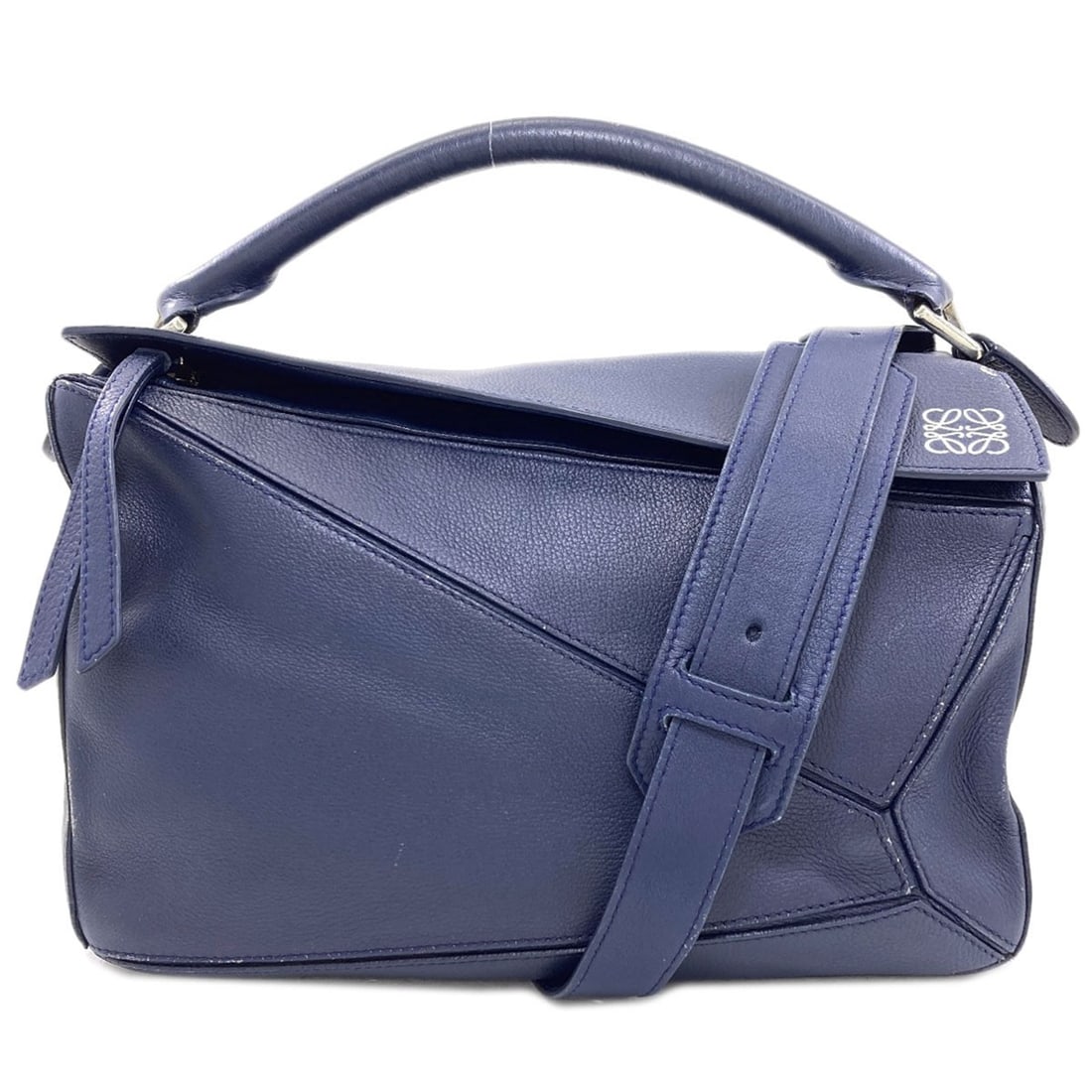 Loewe Puzzle Bag 2Way Handbag Calf: Loewe Puzzle Bag 2Way Handbag Calf Navy Loewe Puzzle Bag 2Way Handbag in Calf Leather. This iconic handbag features a classic design with a 2-way closure, showcasing the signature Puzzle Bag style. Wi