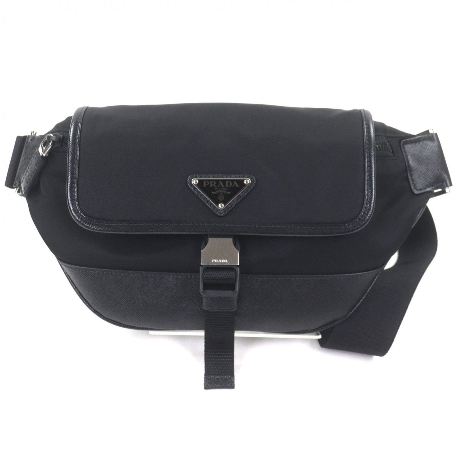 Nylon Leather Sling Prada: Nylon Leather Sling Prada Prada Country of Origin: Italy, this nylon leather sling bag features a striking black color and a unique blend of materials. The bag's dimensions are 17cm x 31cm x 6.69'' x 