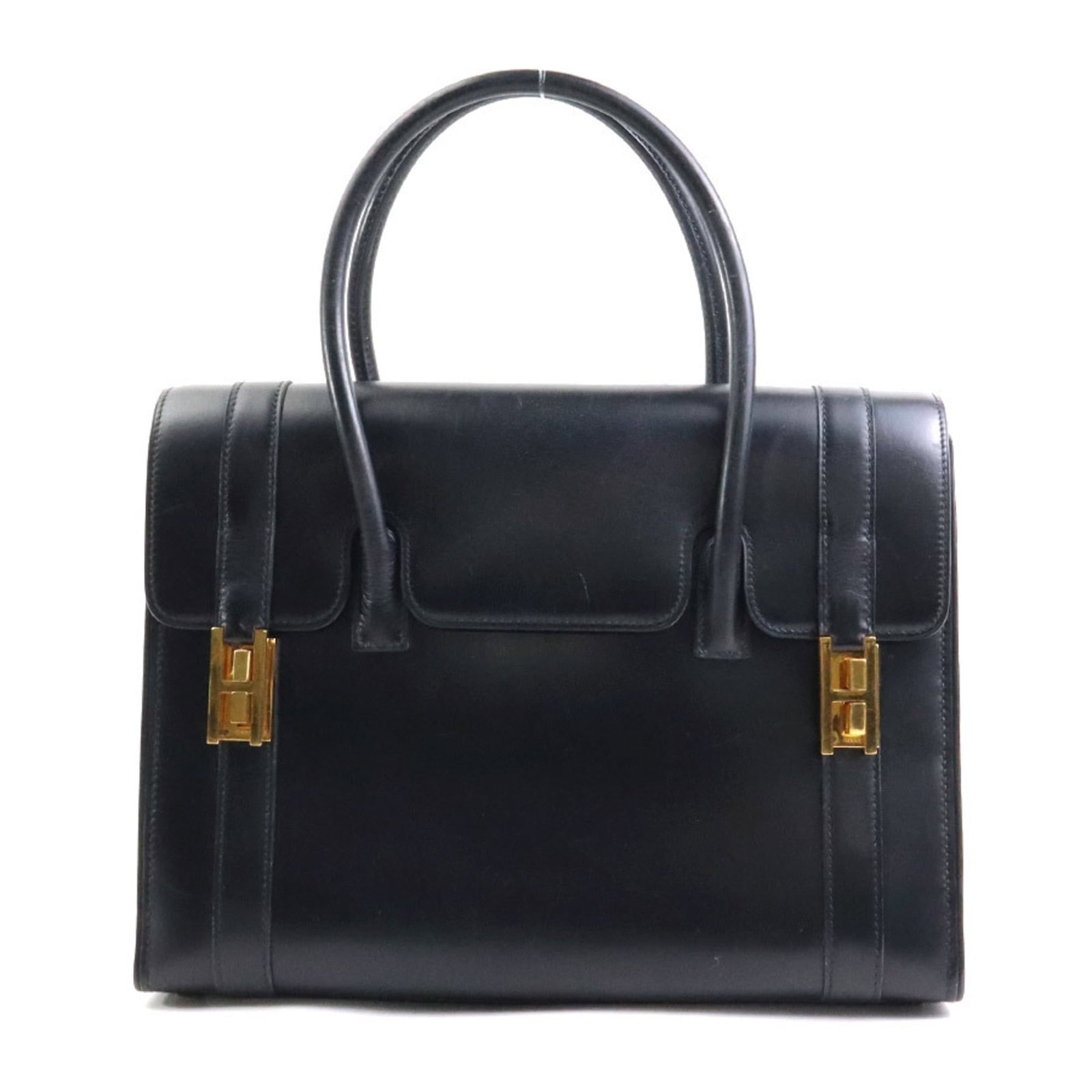 Calf Leather Handbag Box Hermes: Calf Leather Handbag Box Hermes Box calf leather construction provides a rich, luxurious feel to this black handbag. The gold hardware adds a touch of elegance, complementing the sleek design of this 