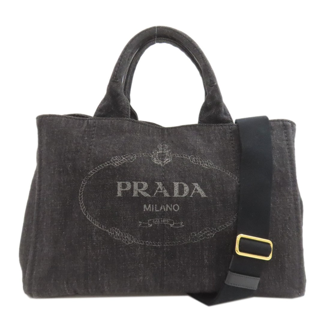 Denim 2Way Handbag Canapa Prada: Denim 2Way Handbag Canapa Prada Denim 2Way Handbag Canapa Prada is made of denim exterior with black interior. The bag features a 2-way design, highlighting its unique functionality. Item Specifics: