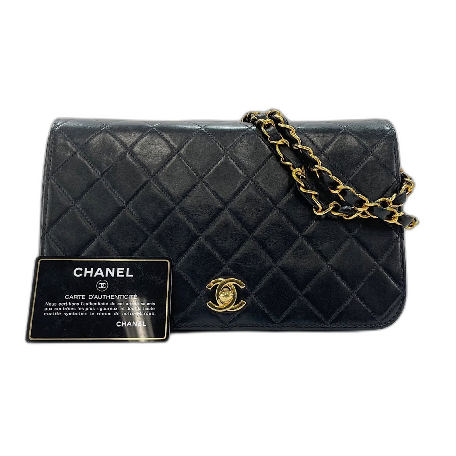 Shoulder Bag by Chanel: Shoulder Bag by Chanel The sleek and sophisticated Matelasse shoulder bag by Chanel boasts a timeless design with clean lines and a chic black hue. Measuring 14cm x 24cm x 6cm, this compact bag