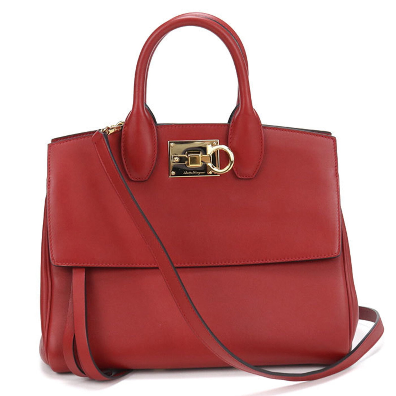 Bag Leather Salvatore Ferragamo Tote: Bag Leather Salvatore Ferragamo Tote Red leather Salvatore Ferragamo tote bag with gold hardware, crafted from high-quality calfskin. Measuring 23cm x 28cm x 13cm, this stylish tote features a classic