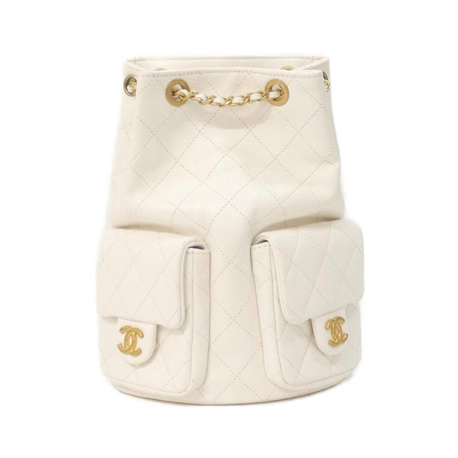 Backpack Leather By Chanel: Backpack Leather By Chanel Lamb leather backpack from Chanel, featuring a classic design with matte gold hardware in a crisp white finish. The sleek, compact shape measures 25cm x 18cm x 9cm. A stylis