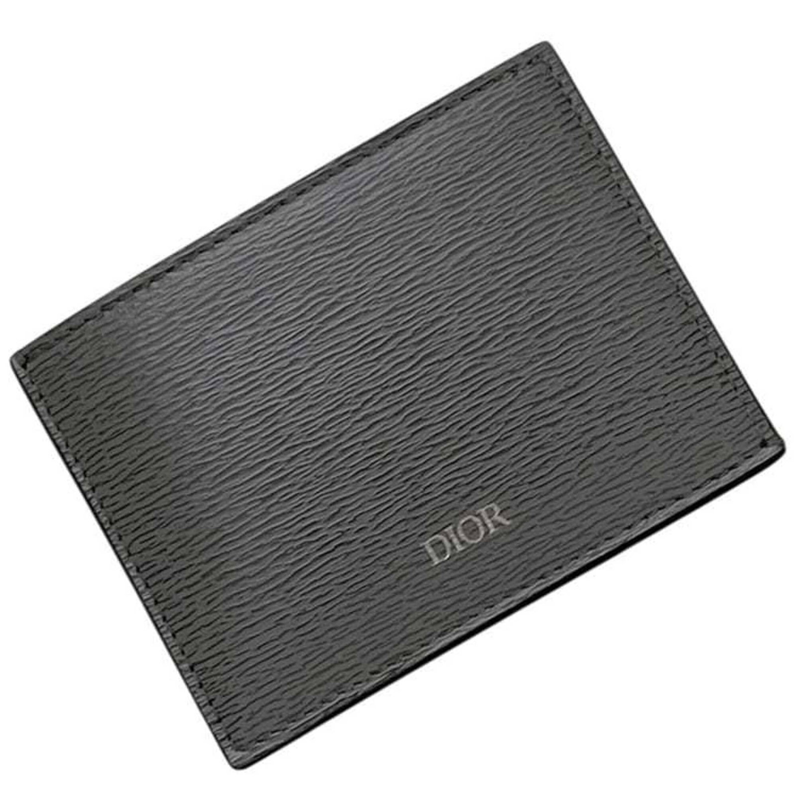 Card Case Leather By Dior: Card Case Leather By Dior Card case by Christian Dior, featuring a sleek gray leather design with a compact size of 7.5cm x 10cm x 1cm. This stylish accessory is made from high-quality leather and