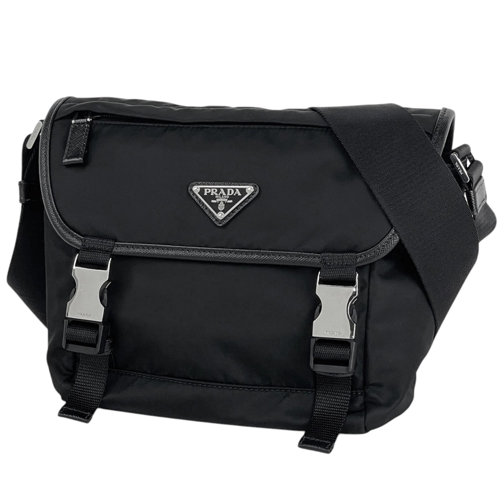 Shoulder Bag Nylon Leather Prada: Shoulder Bag Nylon Leather Prada Nylon and leather blend creates a unique look in this black shoulder bag from Prada, measuring 17cm x 22cm x 10cm. The bag's nylon and leather construction provides a 