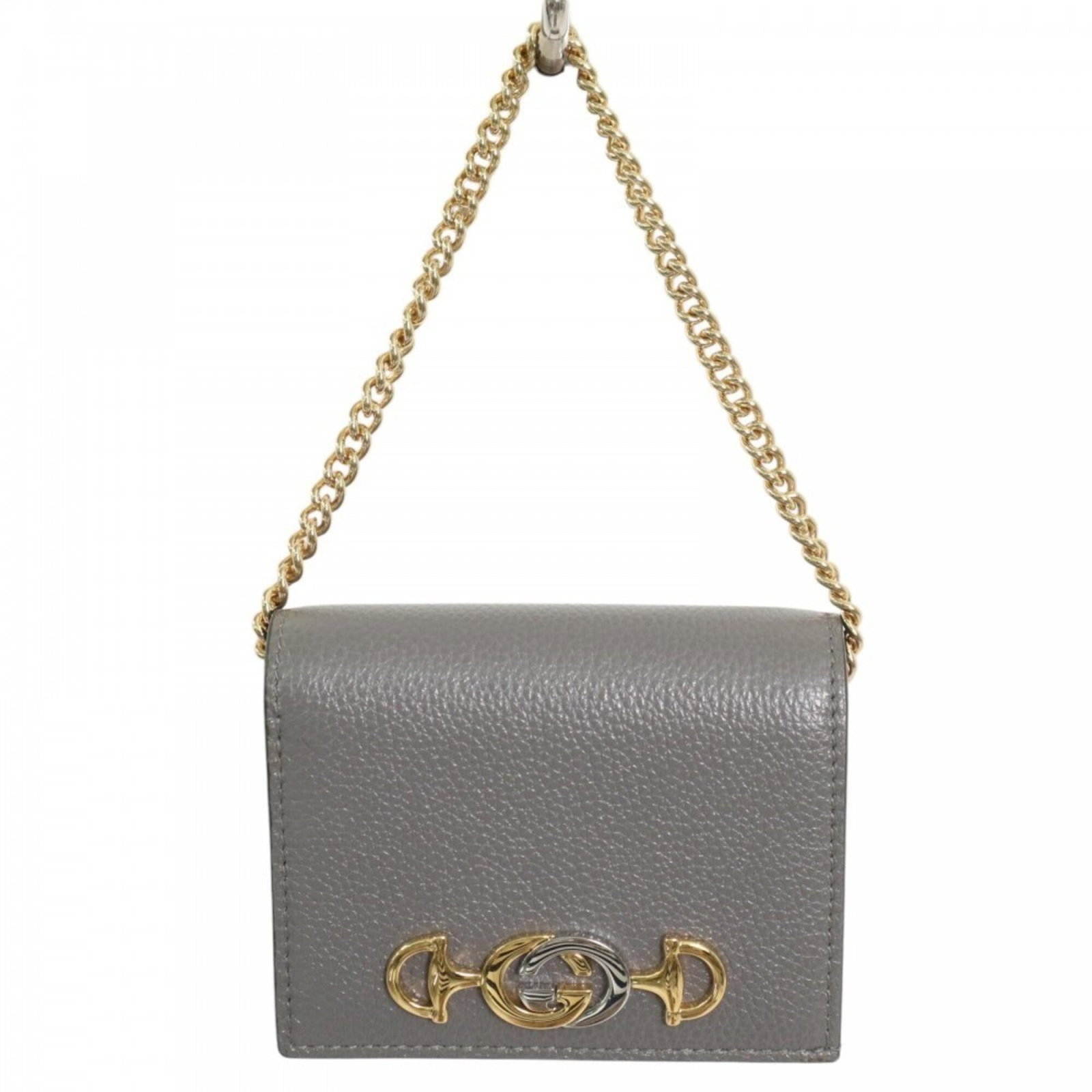 Gucci Wallet (Bi-Fold) Leather: Gucci Wallet (Bi-Fold) Leather The Gucci bi-fold leather wallet boasts a sleek gray color and compact design, measuring 8.5cm x 11cm x 4cm. Made from high-quality leather, this wallet features a class