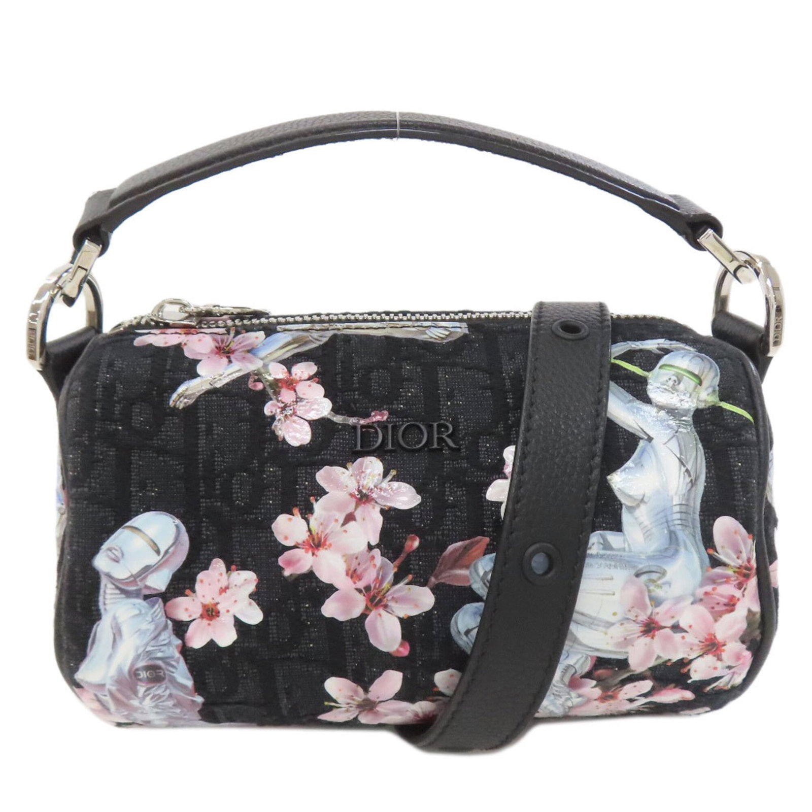 Christian Dior Handbag Canvas: Christian Dior Handbag Canvas Canvas bag from Christian Dior, featuring a black color and adjustable shoulder strap. Measuring 11cm x 18cm x 11cm, this handbag is a compact and stylish accessory. The 