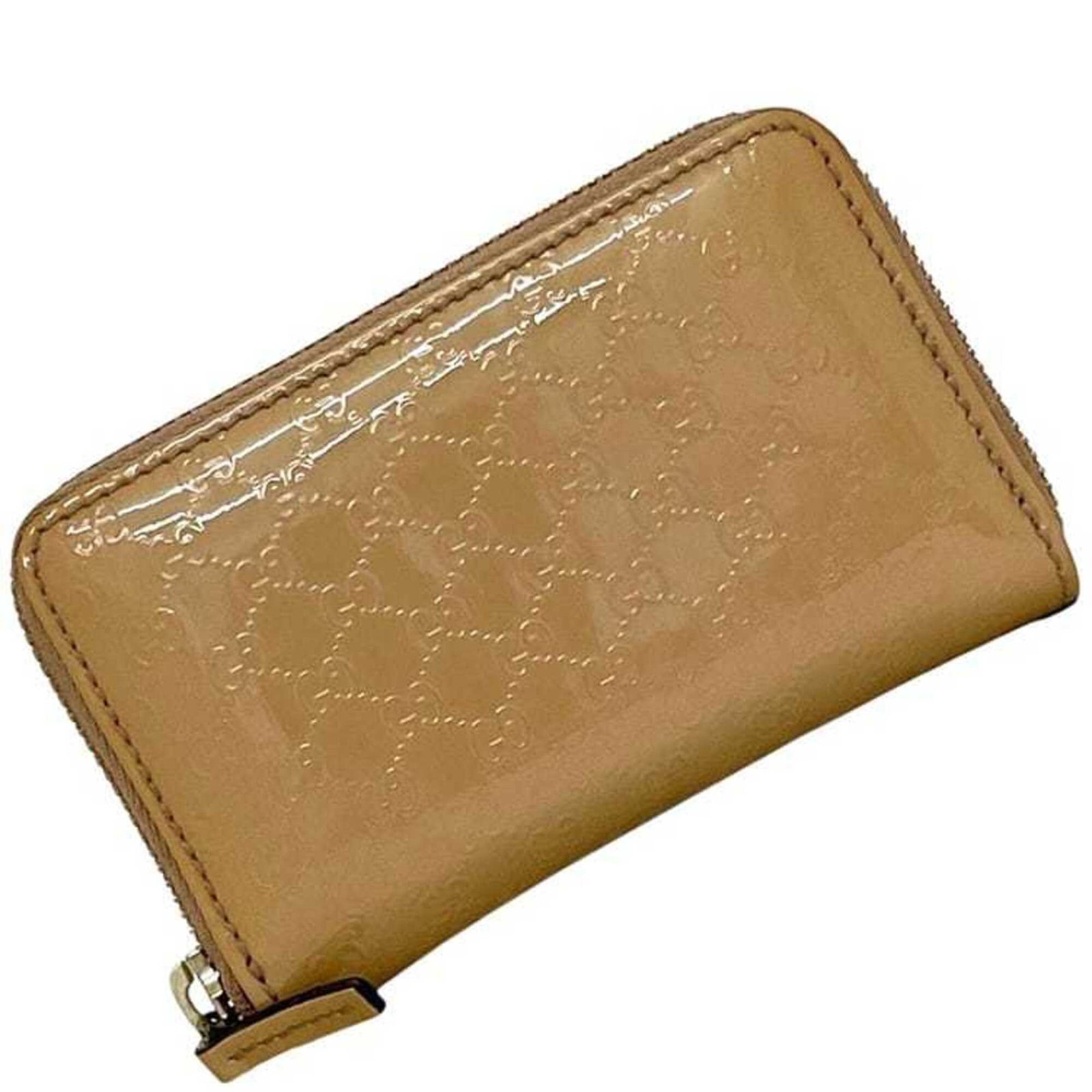 Gucci Coin Purse/ Coin Case Patent Leather: Gucci Coin Purse/ Coin Case Patent Leather Patent leather coin purse from Gucci, featuring a classic design with a beige color. Made from high-quality patent leather, this small purse measures 8cm x